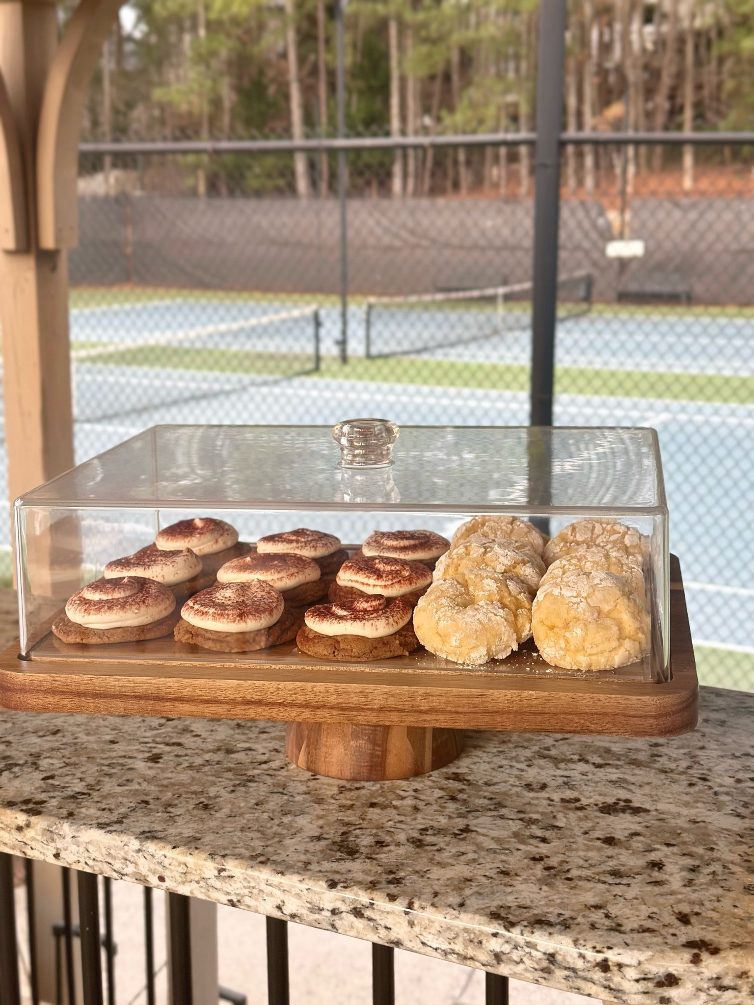 Okay, I might be getting old, but I’m way too excited about this 2-in-1 cake stand 😅. For all the people who love to entertain or always bring food to events—this is a game changer and I couldn’t gate keep this product. 

I used it for the first time at my tennis match. I had homemade tiramisu cookies with mascarpone frosting and lemon crinkles, and this stand was the perfect way to show them off. Not only is it amazing for cookies, but flip it over, and it turns into the ultimate charcuterie board—chips, fruits, cheeses, you name it and the stand acts as a bowl. It keeps everything fresh and looking gorgeous, and I just couldn’t keep it to myself. There’s also a rectangular acrylic piece that slides on top of the wood so you can take a cake or charcuterie directly from the fridge to the stand. My mind was blown. 

I cannot wait to use it for cakes next! Honestly, this cake stand might just be my new best friend.

#LTKSaleAlert #LTKParties #LTKFamily