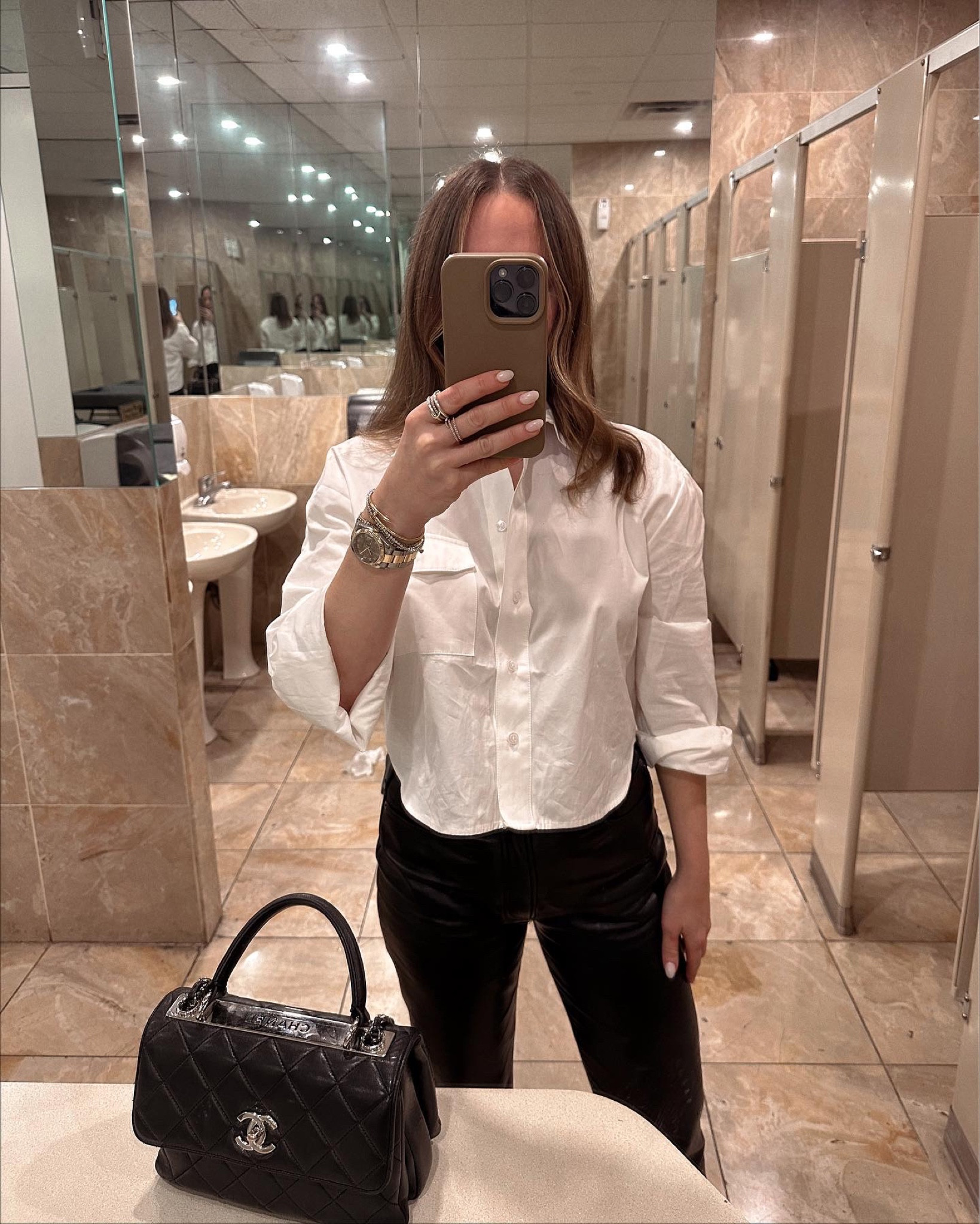 I am wearing a small in the top. The leather pants run TTS.