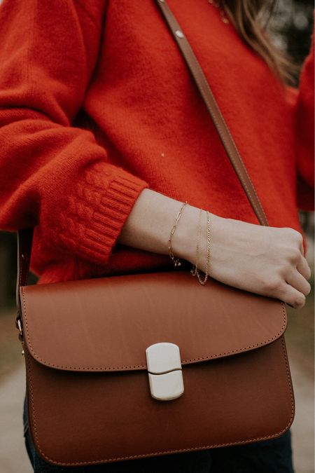 Red sweater with brown leather crossbody bag. Sezane milo bag outfit. Layered gold bracelets  

#LTKitbag