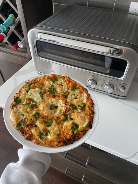 One of the best home purchases I’ve ever made — the Breville indoor pizza oven. It makes delicious, fresh, homemade pizzas in minutes and also makes frozen pizzas (like this one) taste like restaurant quality! 🍕 

#LTKGiftGuide #LTKMostLoved #LTKhome