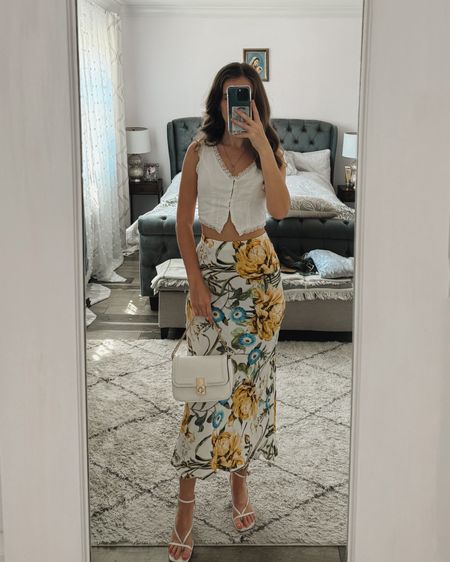 A dressy top paired with a floral midi skirt, white heeled sandlas and a handbag makes a cute date night or spring outfit idea. 
.
.
.
.
.
.
.
Date night outfit | skirt outfits | floral maxi skirt | long skirt outfits | midi skirt outfits | cute tops | spring tops | date night tops | brunch outfit spring | dinner outfit | dressy outfits | spring shoes Summer outfit | summer sandals | white sandals | white heels | designer bags | outfit inspo 

#LTKGiftGuide #LTKSeasonal #LTKFind #LTKunder50 #LTKunder100 #LTKU #LTKsalealert #LTKfindsunder50 #LTKfindsunder100 #LTKstyletip #LTKworkwear #LTKtravel #LTKshoecrush #LTKitbag #LTKparties