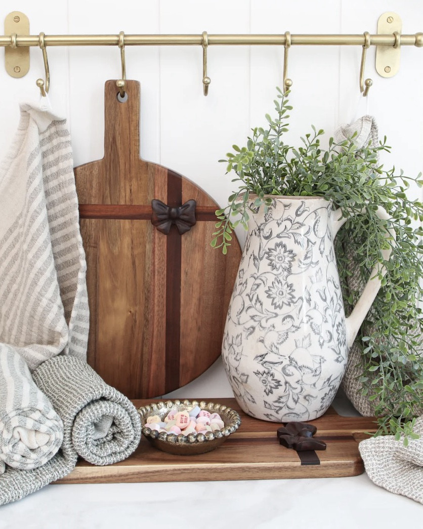 Our rectangle acacia board with a carved bow detail adds a warm, festive touch to everyday serving and seasonal styling. Hole in the top to hang anywhere. 

#LTKSeasonal #LTKValentine #LTKHome