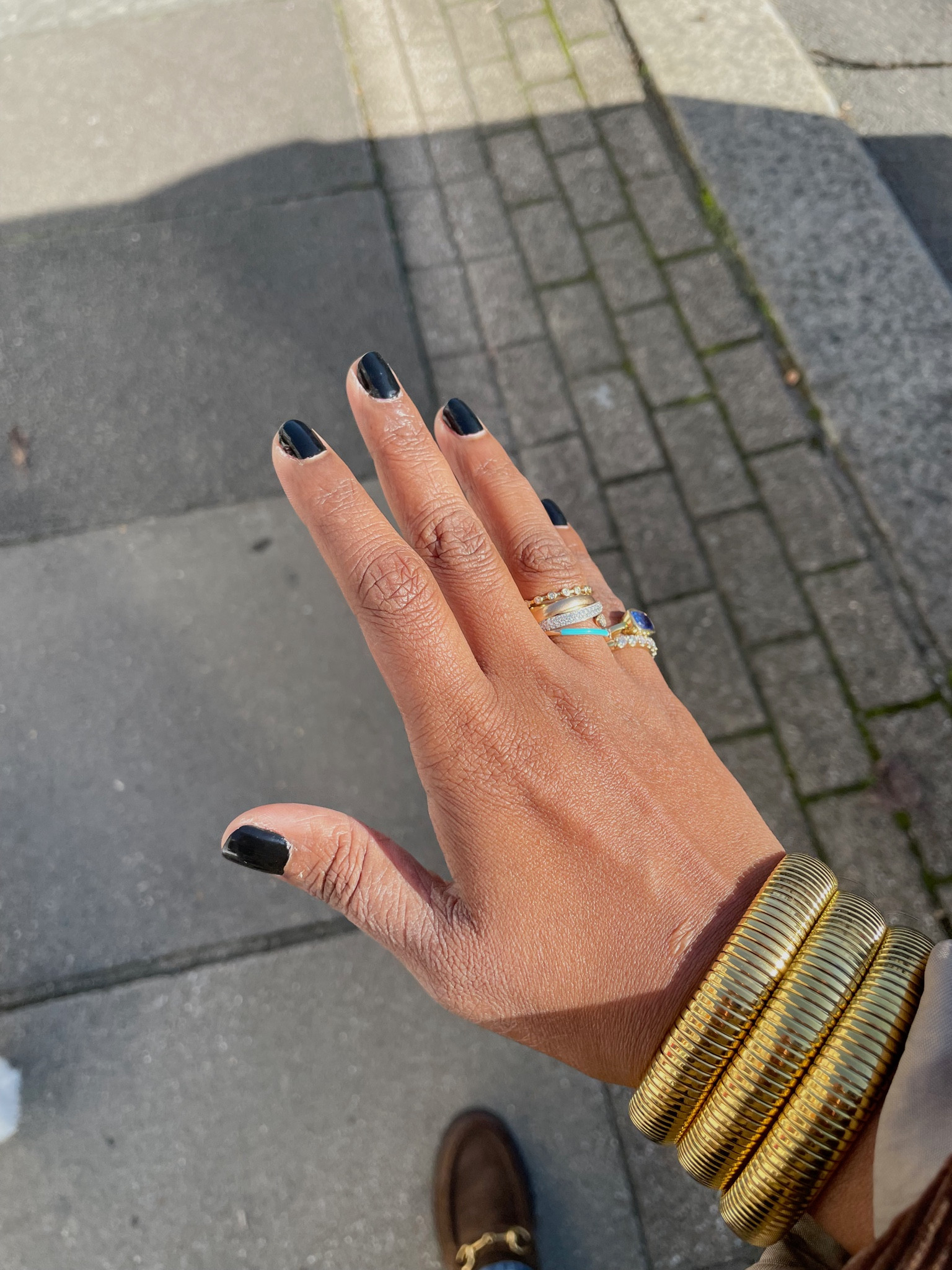 Black nails & gold bangles 