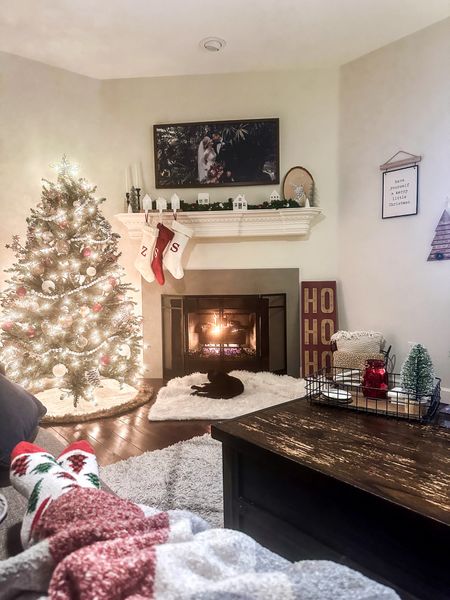 Cozy Christmas fireplace setting, rustic farmhouse Christmas living room setup, 6 foot Christmas tree decor. Cozy holiday living room vibes 

#LTKHoliday #LTKfindsunder100 #LTKSeasonal
