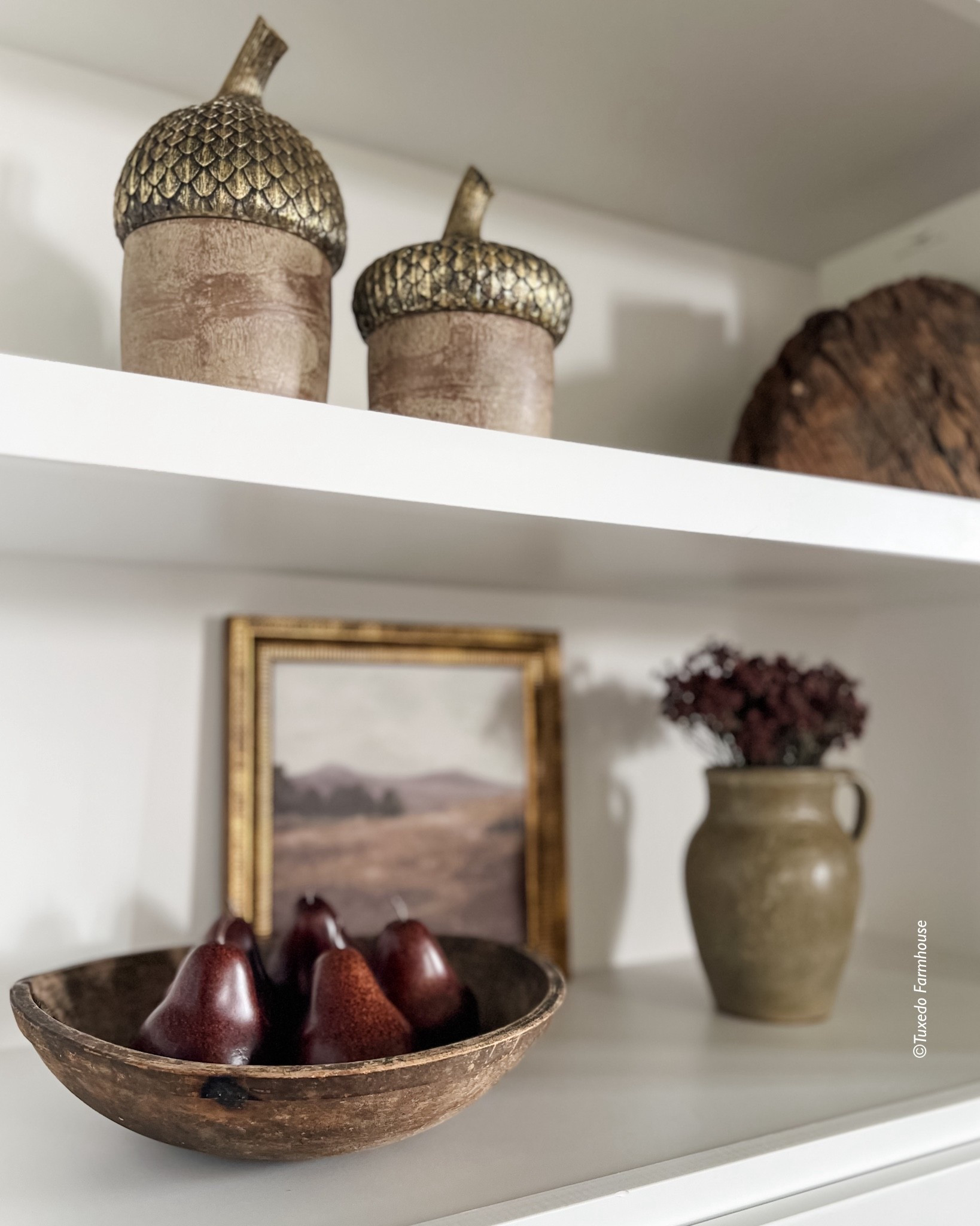 Moody art and pears in a wood bowl, a vase of florals and fun acorn decor are great picks for fall shelf styling  

#LTKFindsUnder50 #LTKSeasonal #LTKHome