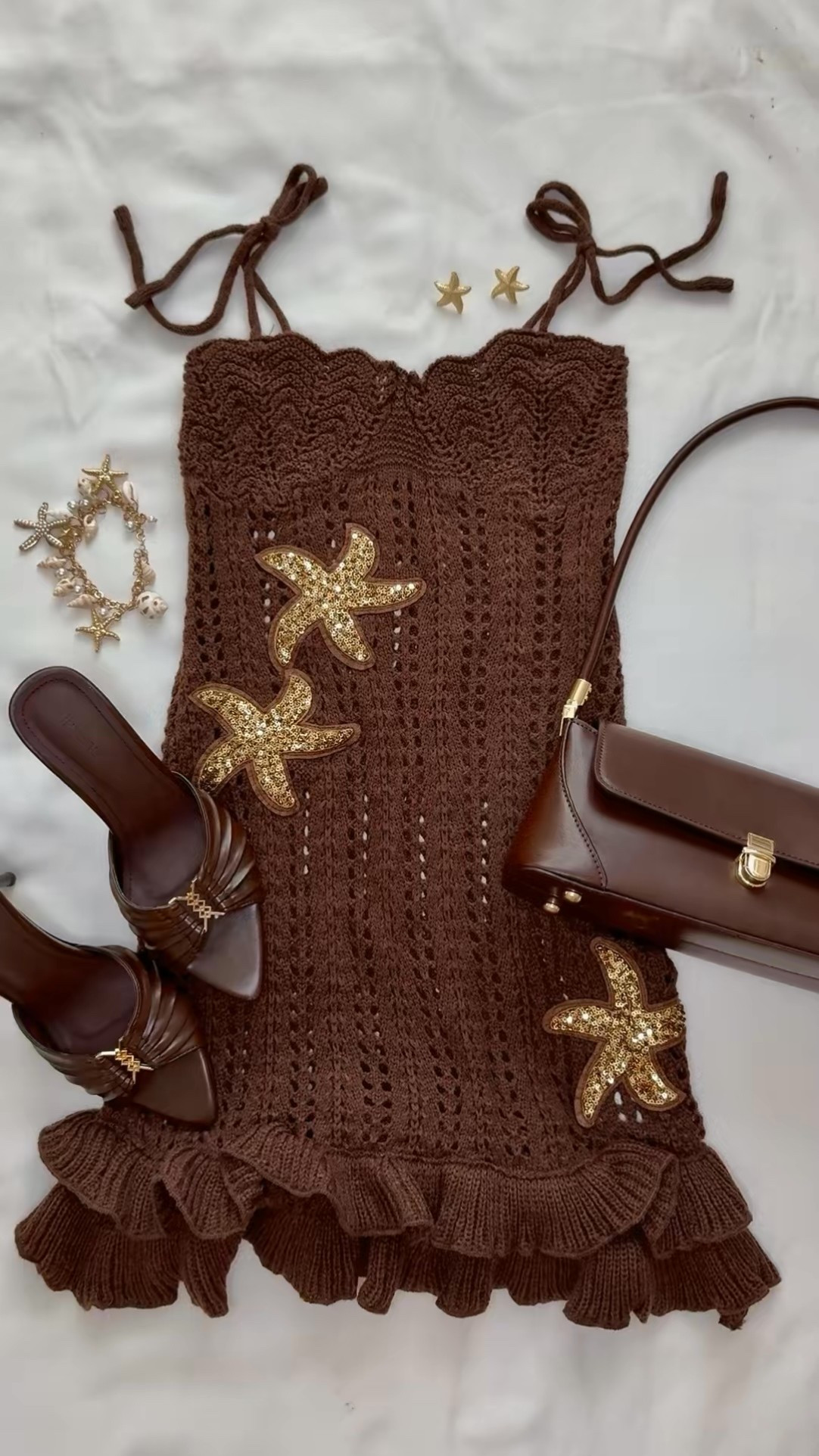 Chocolate brown is having a major moment 🤎 Styling the perfect late summer vacation outfit with a crochet mini dress, brown kitten heels, gold starfish accessories + a chocolate shoulder bag. Save this look for your next beach vacation, European summer trip or summer date night ✨

#ltkfashion #summeroutfit #vacationoutfit #resortwear #crochetdress #brownoutfit #summerstyle #beachvacation #datenightoutfit #ltkfinds