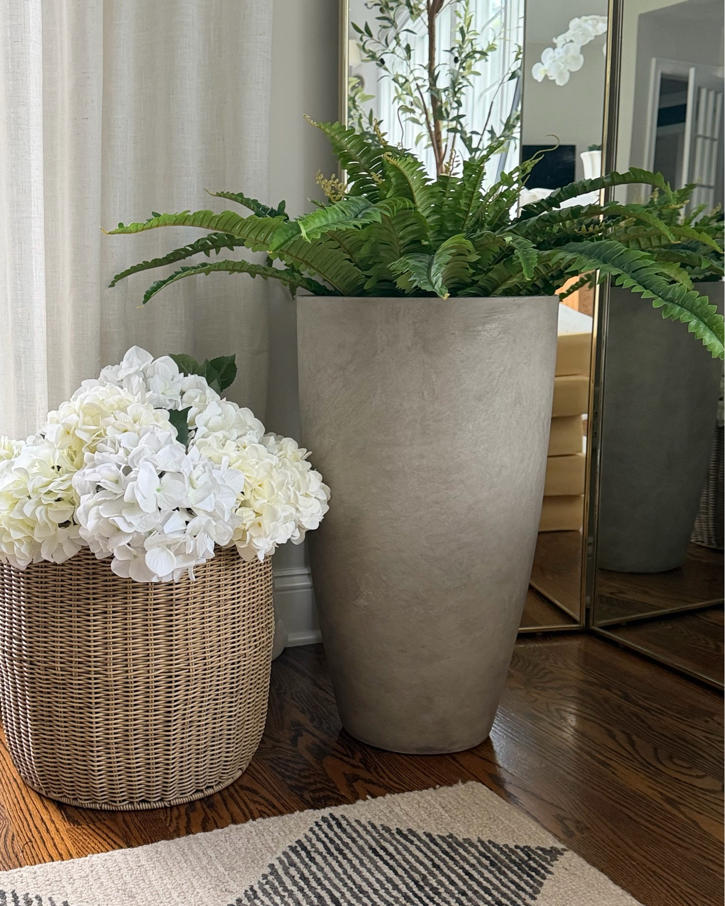summer greenery & florals never looked so good! 🪴

This large 45” artificial fern comes in a set of 2 and the price is super affordable! Plus it’s uv-resistant & very realistic looking! 

Place it in a wicker basket or an oversized concrete planter and display it on your deck or front porch to impress your neighbors all summer long! 😉

notes:
👉🏻 wicker planter with scalloped top is from Marshall’s (sold out online)
👉🏻 faux hydrangeas are a mixture of two bouquets (5 stems each) from Amazon & two stems from Pottery Barn (sold out).

.
.
#summerdecor #coastalliving #summerplants #hydrangeas #budgethomedecor #fauxferns #outdoorliving #backyardrefresh #founditonamazon
cottage core aesthetic
coastal cottage style
cottage chic planters
blue white summer decor
preppy summer living room 
wicker baskets
woven planters
seagrass home decor

#LTKSaleAlert #LTKHome #LTKSeasonal