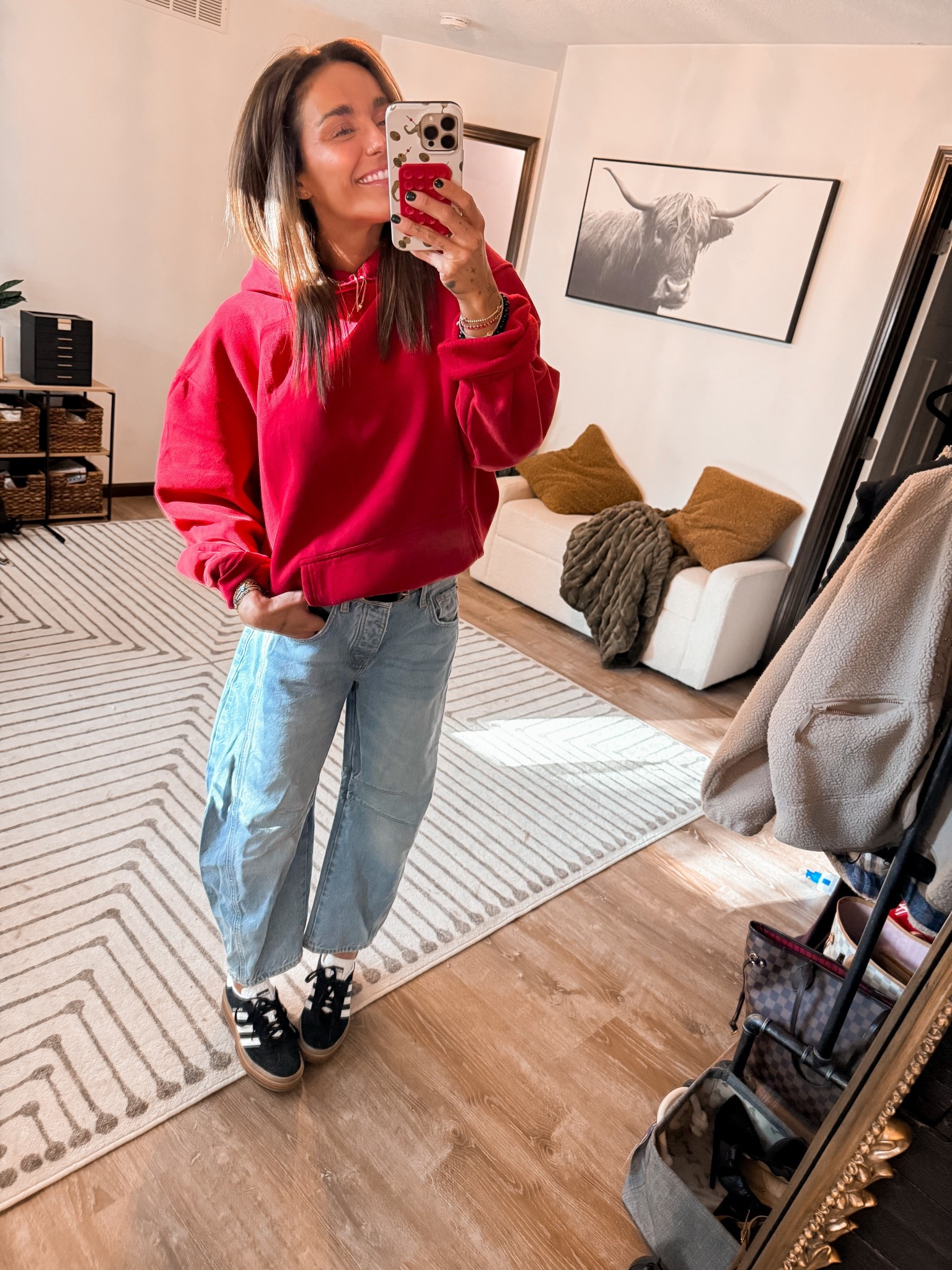 Sports mom ootd ❤️ 🖤 🤍 
Sweatshirt: large
Jeans: sized down 24 
Shoes: size down at least half a size 
Game day outfit 
#LTKFallSale 

#LTKSeasonal #LTKActive