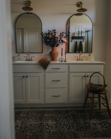 Bathroom runner, gold vanity lights, wicker vase, vintage stool, arch mirror 

#LTKhome