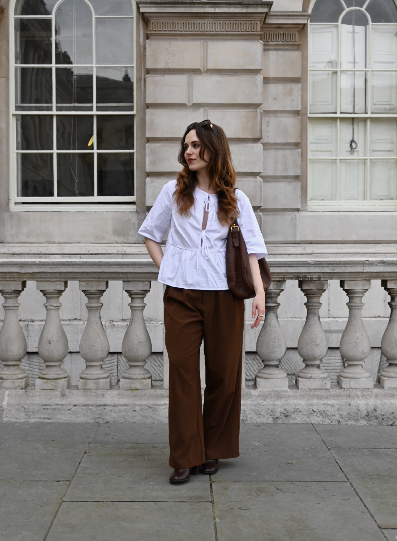 Keeping it simple with a white tie blouse, brown suit trousers, brown ankle boots, Celine sunglasses and a preloved Prada leather handbag 

#LTKeurope #LTKstyletip #LTKfindsunder100