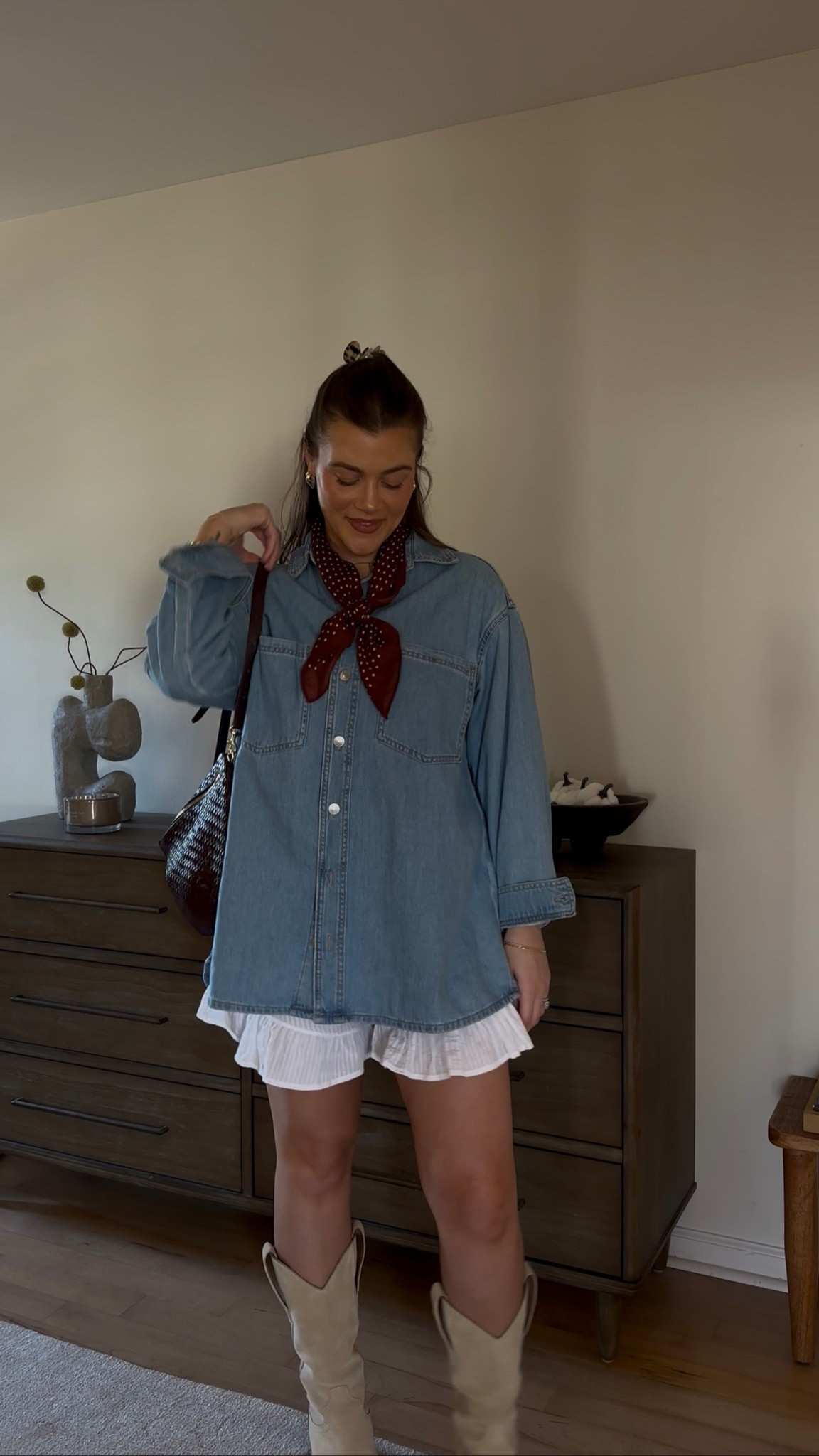 Pair this denim shirt with these white ruffled shorts from Amazon and suede cowboy boots, for the perfect fall fit. scarf was a Marshalls find but linked similar.