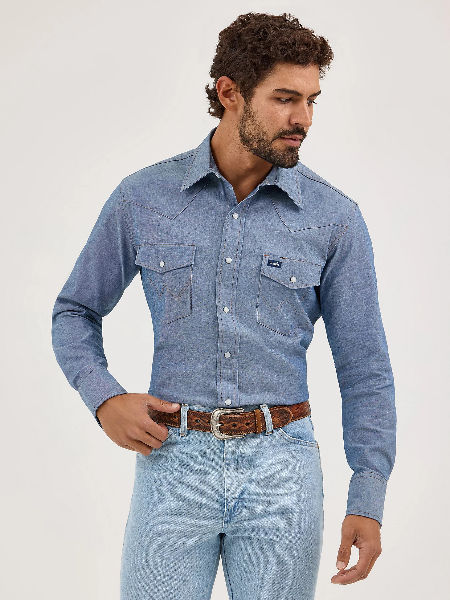 Cowboy Cut® Firm Finish Long Sleeve Western Snap Solid Work Shirt in Chambray Blue | Wrangler