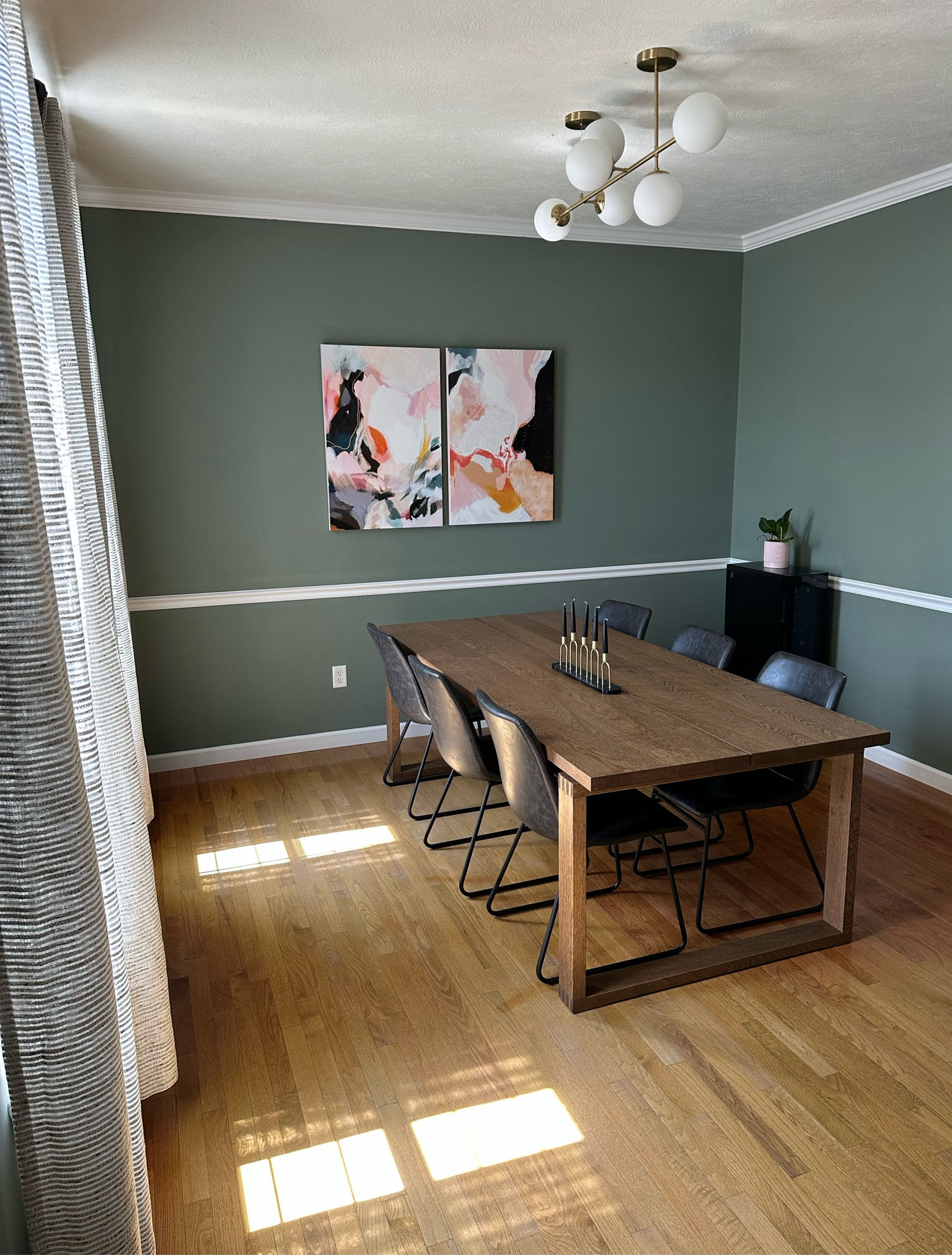 Dining room makeover. 

Farrow and Ball, Card Room Green, abstract art, mid century modern dining room, globe pendant chandelier, wine fridge

#LTKhome #LTKfamily #LTKover40