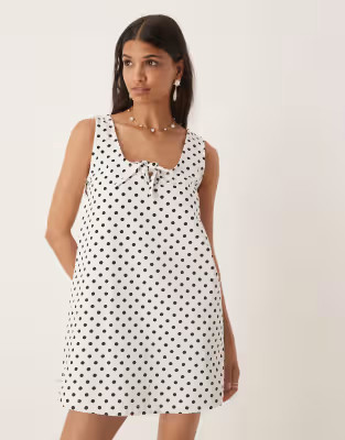 ASOS DESIGN denim scoop mini dress with bow front in polka dots | ASOS (Global)