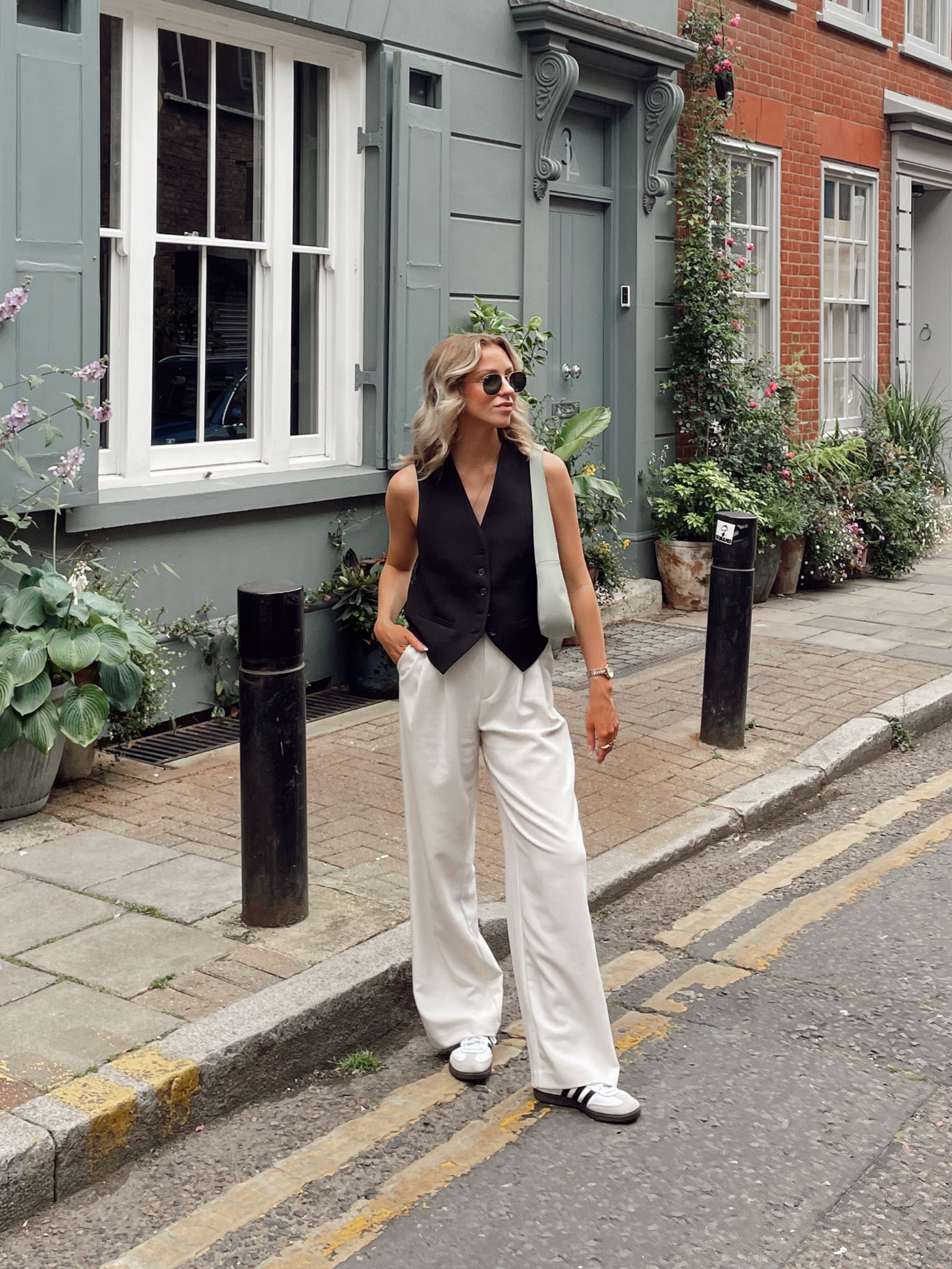Black tailored waistcoat, cream wide leg tailored trousers, adidas sambas, green shoulder bag

#LTKitbag #LTKeurope #LTKstyletip