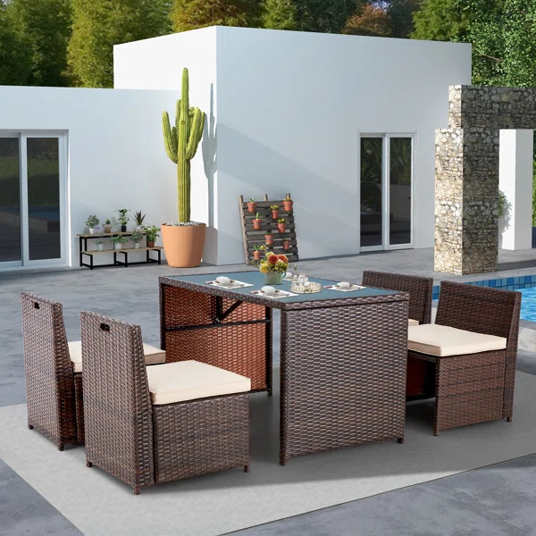 Yushin 4 - Person Rectangular Outdoor Dining Set with Cushions | Wayfair North America