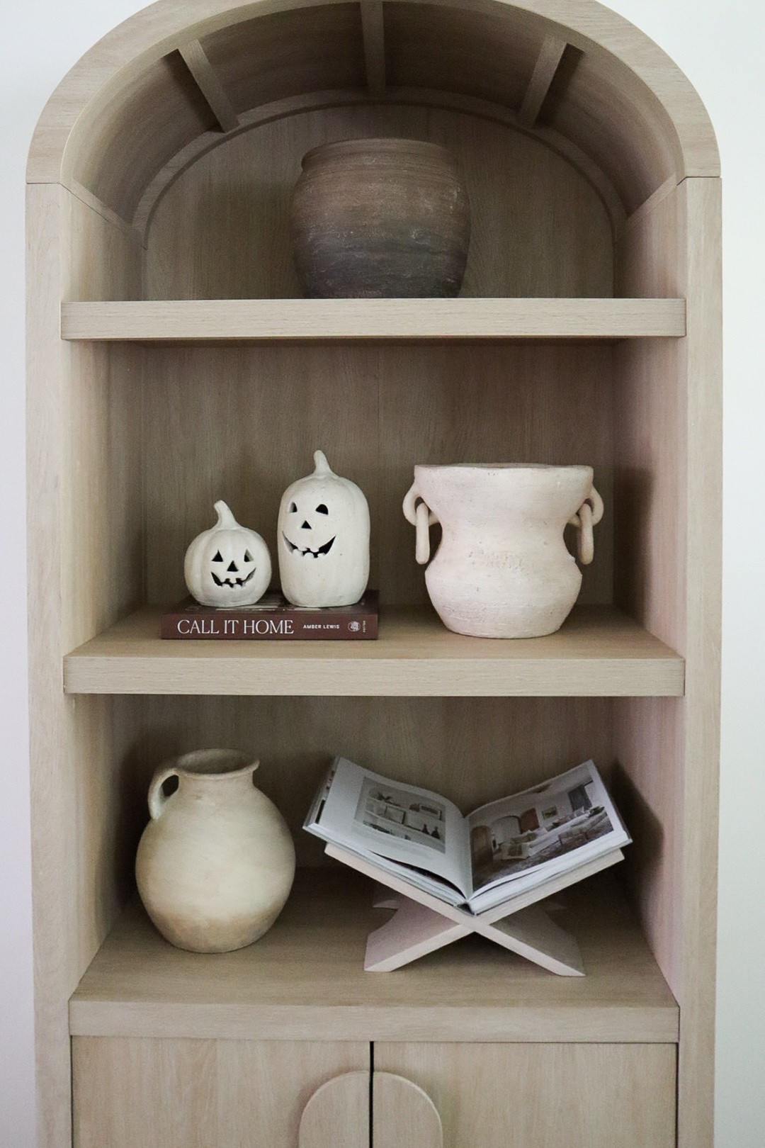 Arched cabinet meets two cute little pumpkins!

#LTKHome #LTKSeasonal