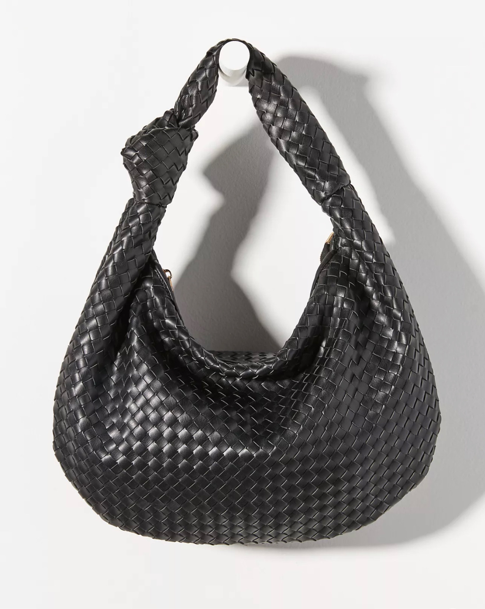 Who doesn’t love a great black purse? This is such a great dupe and tiny fraction of the cost of the original. I think this style will look so great paired with turtlenecks and sweater dresses. There’s something sculptural and chic about the larger size. 
I purchased the original bottega Jodie bag in the midi size a few years ago. I’ve definitely enjoyed it but not sure I want to invest in the same bag but larger size, so this bag for me is a nice try before I invest or perhaps will even fill the gap altogether. It’s soft and lightweight. Comes in multiple colors but I think black is chic. 

#LTKGiftGuide #LTKstyletip #LTKSeasonal