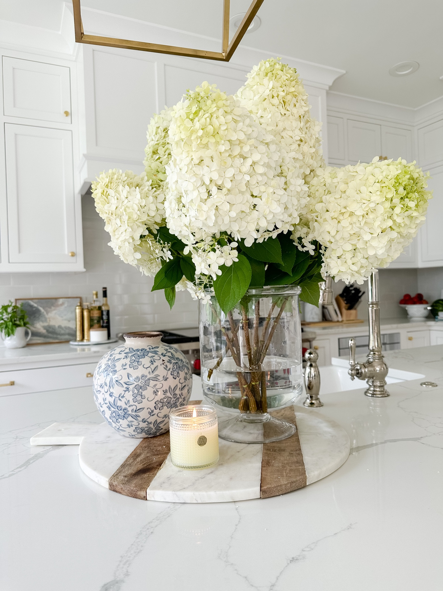 Kitchen island styling, footed vase, marble and wood charcuterie board, blue and white floral vase, Pepper + Vetiver, Amazon find, coastal kitchen, home decor 

#LTKhome #LTKsalealert #LTKunder50