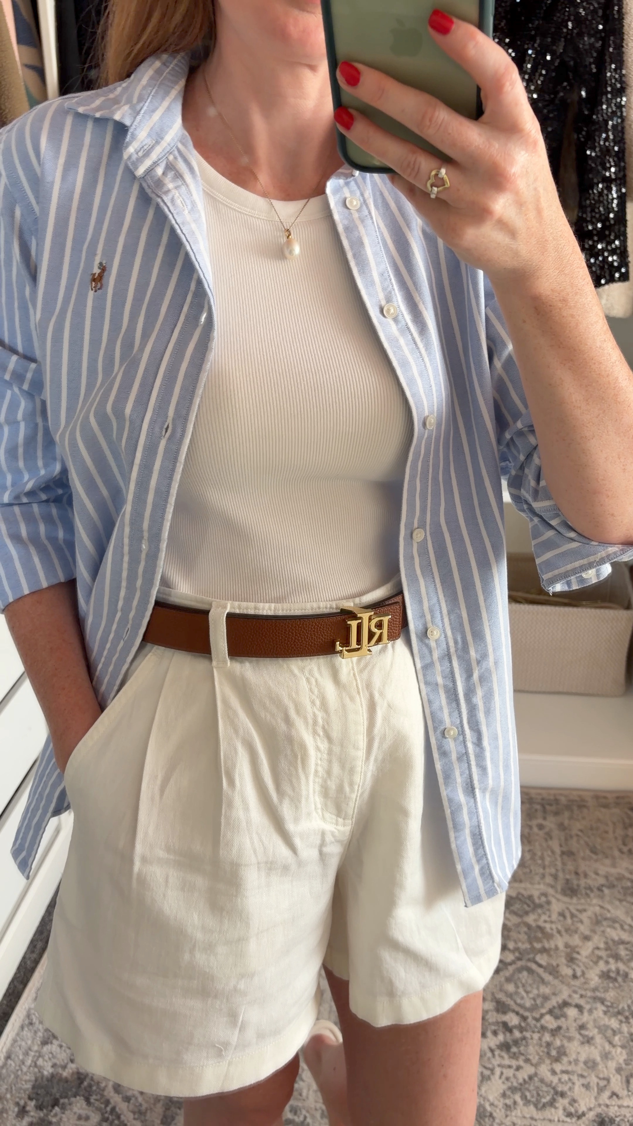 The easiest summer outfit formula 🤍 Uniqlo white vest & shorts, styled with a blue and white Oxford shirt, tan belt and neutral sandals. Simple staples, but the layers and accessories make it feel intentional. summer outfits over 40, business casual workwear @UNIQLO 

 #LTKuk #LTKsummer #LTKworkwear