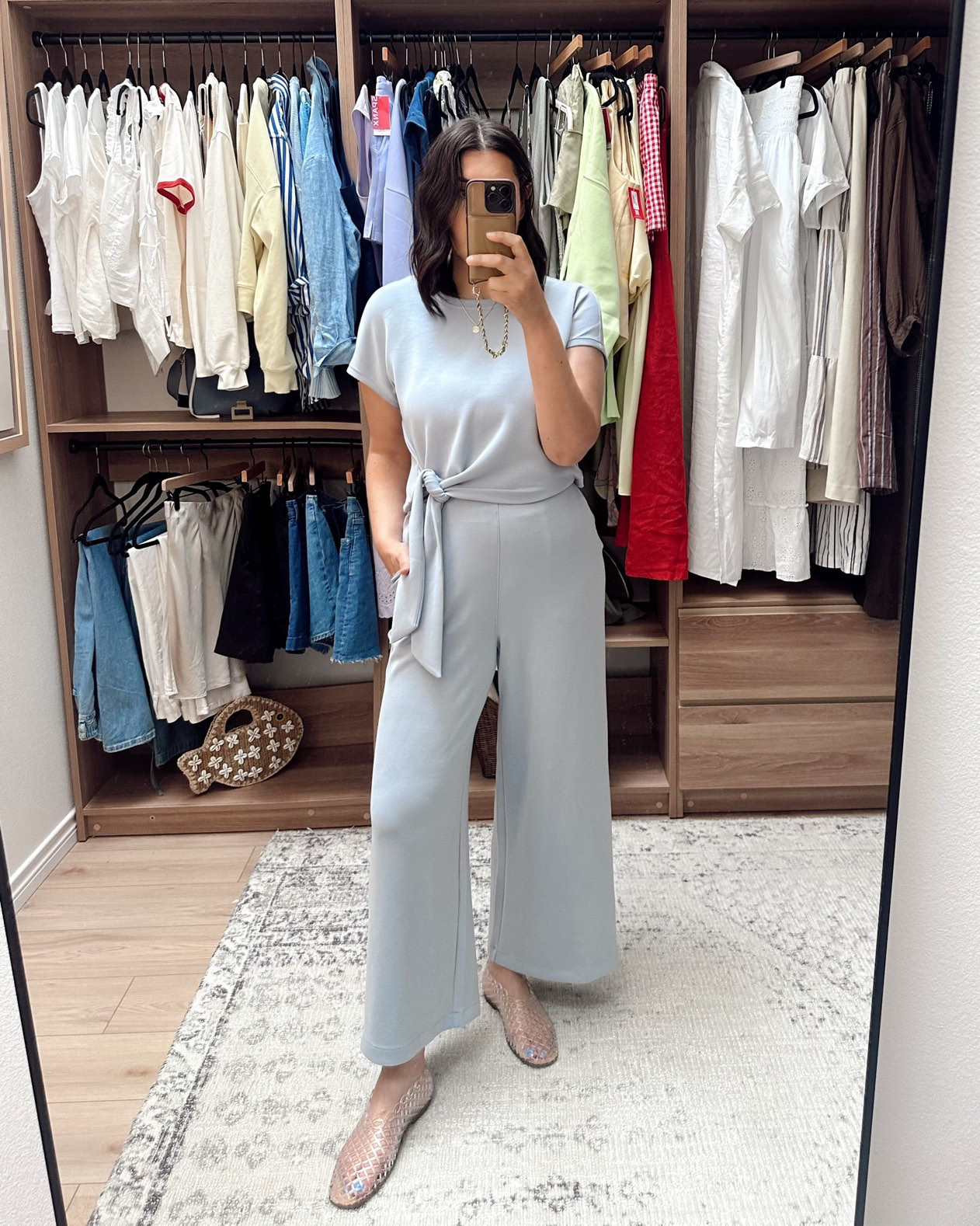 One of my favorites from the AirEssentials line @spanx. It runs loose, and is the softest fabric. I've washed it a few times (on cold, hung to dry) and it looks / feels new. I would say stay TTS! It's very forgiving and flattering.  

 