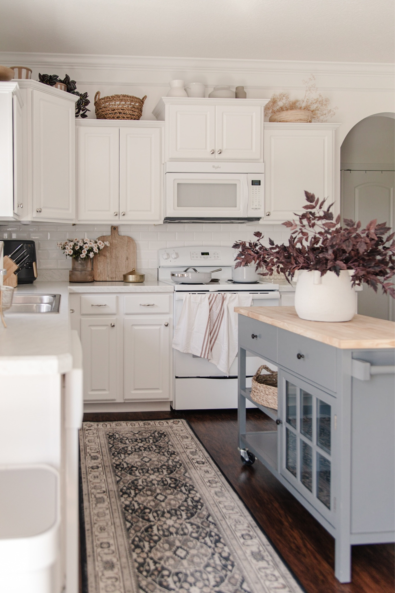 Cozy fall kitchen decor, gray kitchen cart, small kitchen island, artificial purple autumn leaves, decor above kitchen cabinets

#LTKSeasonal #LTKhome #LTKfindsunder100