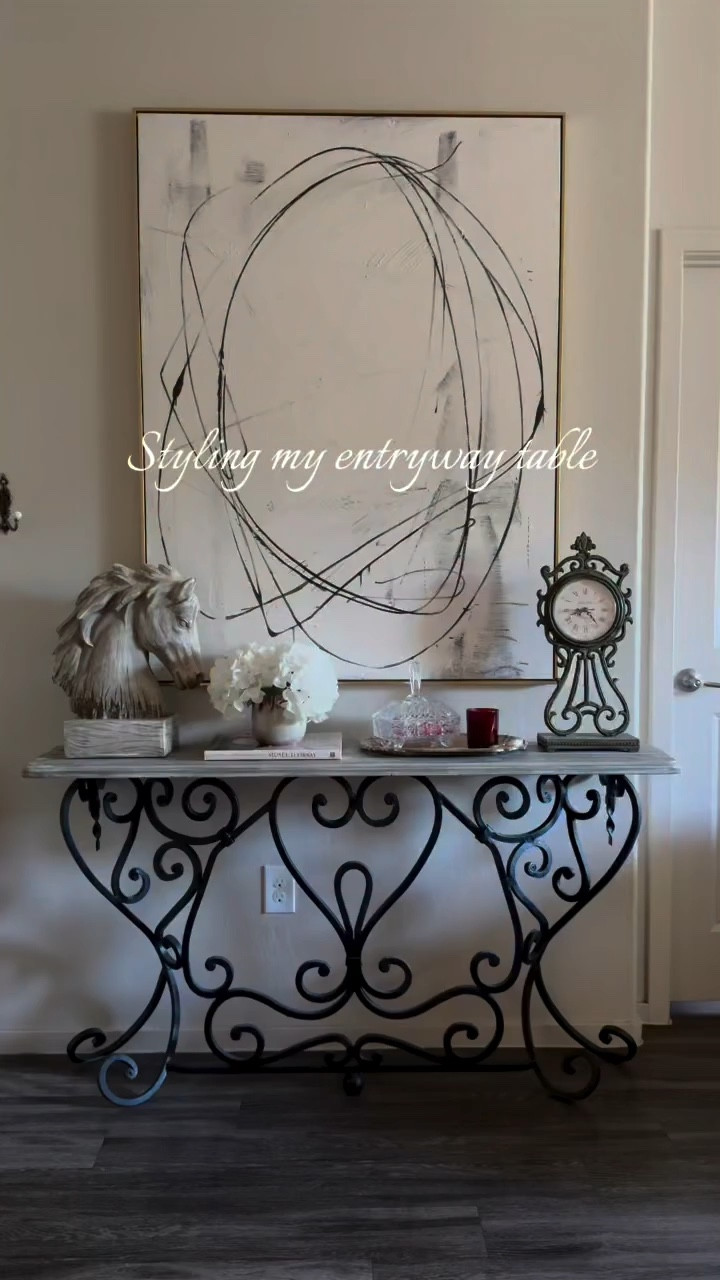 I love decorating with vintage and thrifted finds, then layering in a few newer pieces to keep everything feeling fresh while still holding that vintage flair ✨

The contemporary art adds just enough contrast to keep the space feeling collected and balanced.
.
.
.
.

#entrywaydecor #collectedhome #vintagehome
#thrifteddecor #homedecorideas

#LTKHome