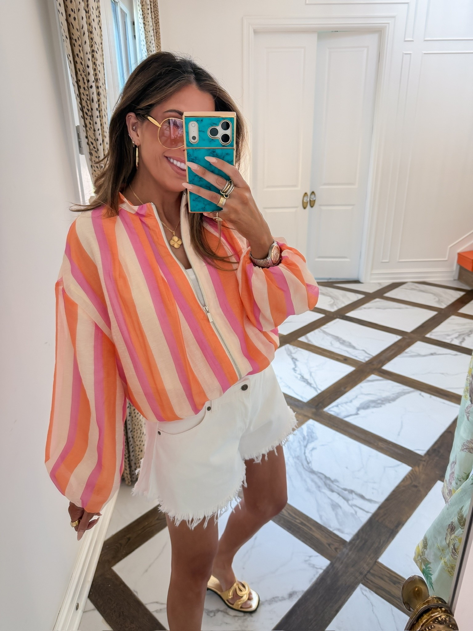 Need a pop of color?! This striped bomber jacket is back in stock!! I’m wearing an XS! My shorts are older from the beginning of this summer! 🧡