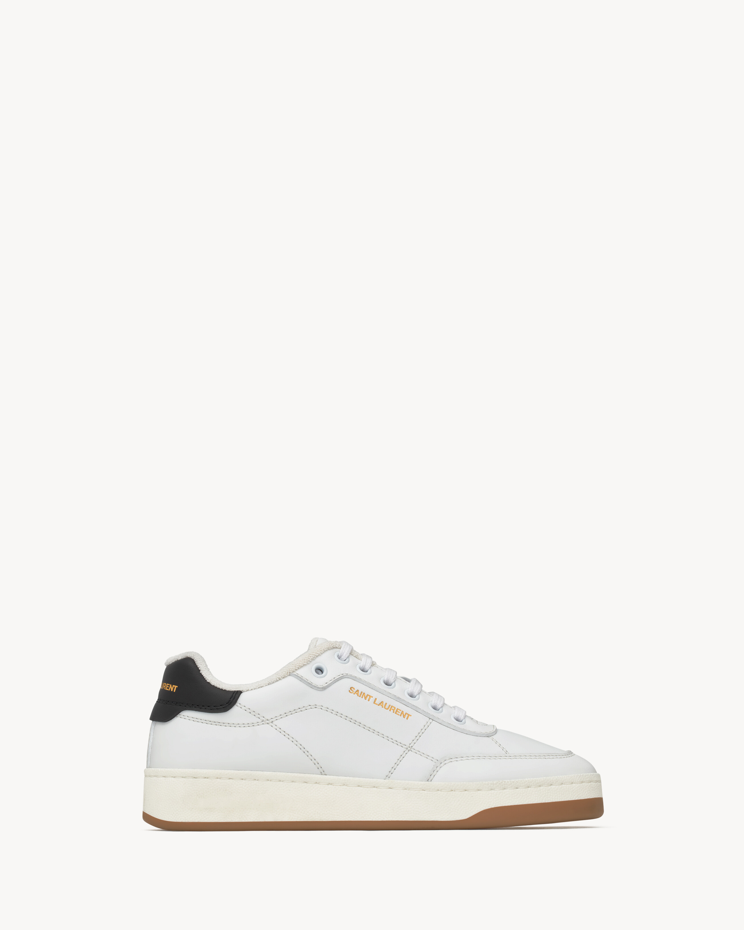 low-top laced sneakers featuring a gold-tone SAINT LAURENT signature on the side and back heel co... | Saint Laurent Inc. (Global)