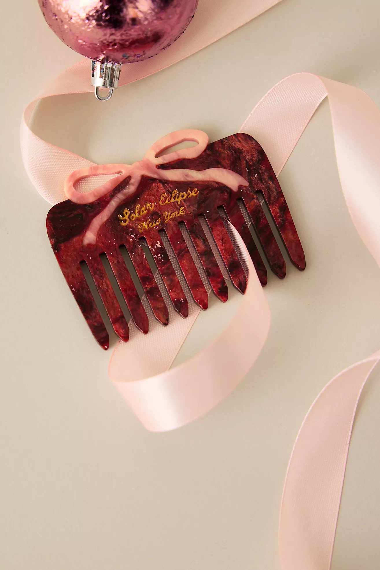 Solar Eclipse Roter Bogenkamm | Anthropologie (EU)