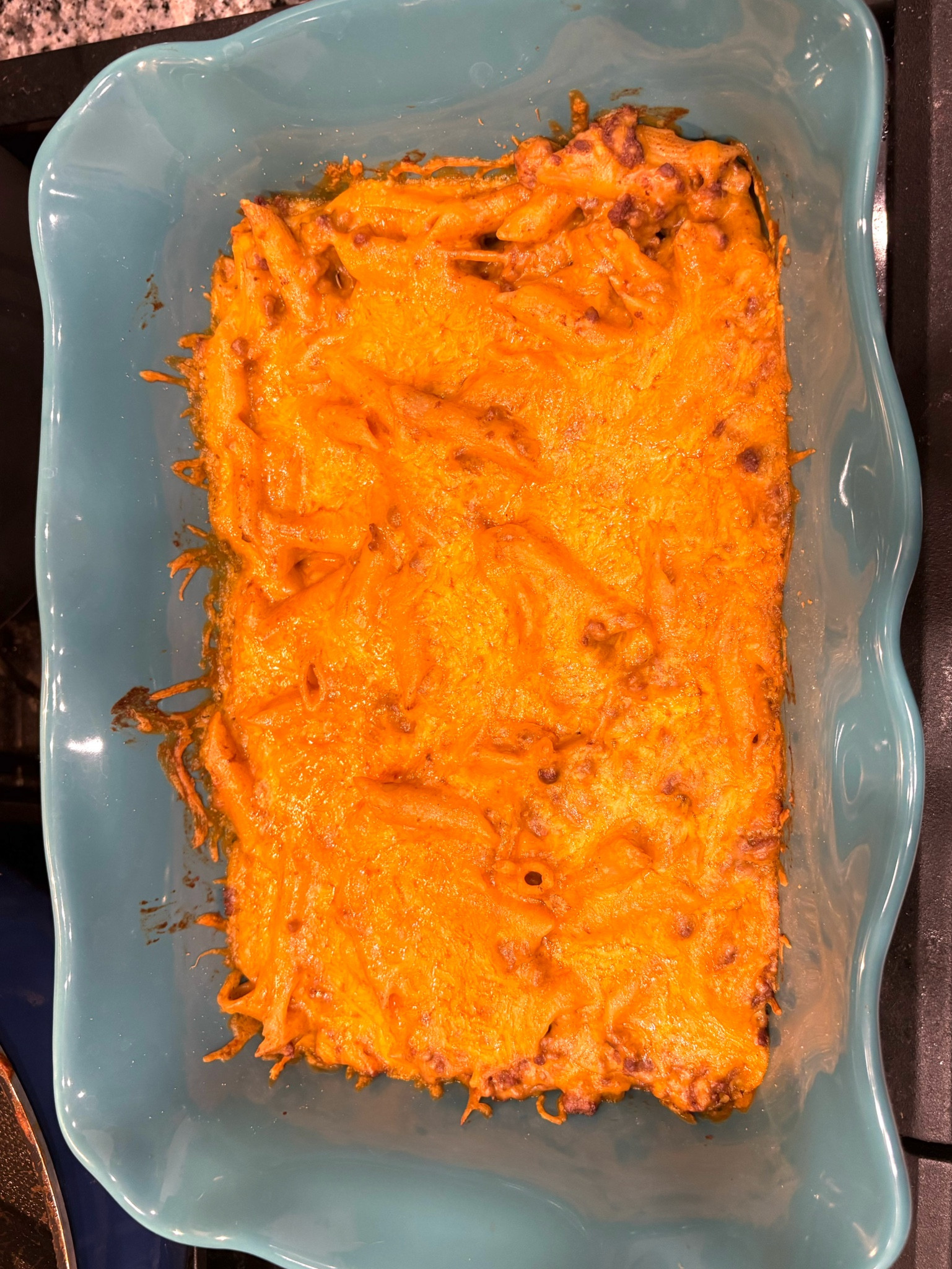 This recipe was a family favorite and so easy to prepare!

Ingredients:
1lb ground beef
8oz noodles
1 10oz can red enchilada sauce 
4oz cream cheese
1 cup shredded cheese 
Salt and pepper to taste

To cook:
Cook noodles according to directions on box/drain

Cook ground beef in large skillet/drain any excess fat 

Add the sauce and cream cheese to meat, stir until combined

Combine the cooked noodles into the skillet and stir until well coated with the sauce 

Preheat the oven to 350F (175c), transfer pasta to a baking dish, coat the top with the shredded cheese

Bake 15-20 minutes 