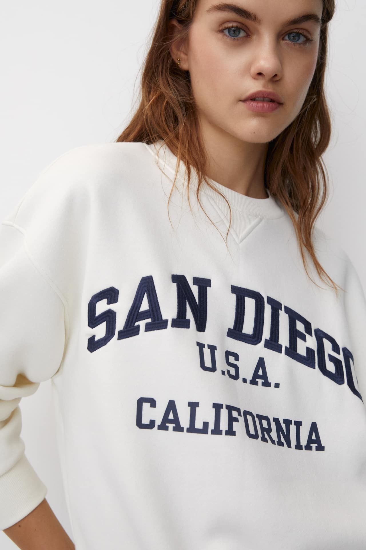 Varsity-style sweatshirt with an embroidered slogan | PULL and BEAR UK