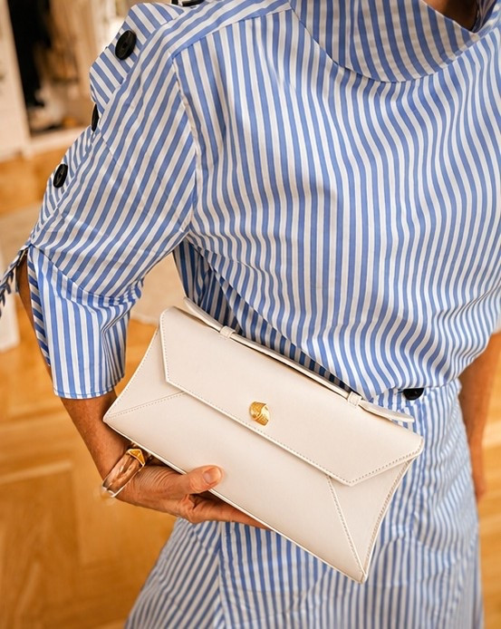 Gorgeous cream leather clutch for summer evenings that will go with EVERYTHING by @Aureum Collective #Ad #Aureumcollective // It’s also on MAJOR sale!! 25% off! Large enough for your phone, sunglasses, keys, all your essentials. 

Tap links below…👇🏻

~Erin xo

#LTKOver40 #LTKSeasonal