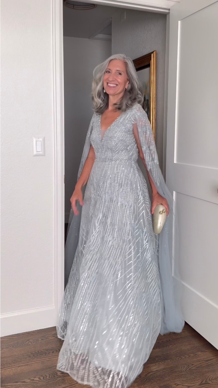 🩵 the beaded cape that makes your arms the most beautiful thing in the room.

A light blue V-neck gown covered in silver beading with a sheer flowing cape that catches every light and moves with total effortless grace.

Use code EMPTYNEST for 10% off at Lara.com (most styles available from petite to plus).

I’m in a size 4 and the fit is beautiful.

Wedding Guest Dress | Fashion over 50 | Mother of the Bride | Mother of the Groom | Black Tie | Formal Gown | Summer Wedding | Dresses to Hide Belly | Special Occasion | Wedding Guest Dress with Sleeves

#LTKSeasonal #LTKOver40 #LTKWedding