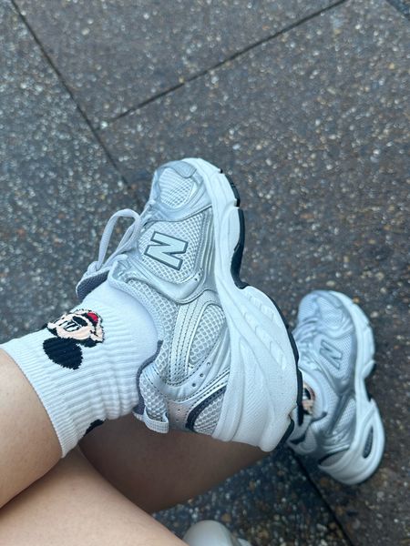Mickey socks and new balance sneakers 