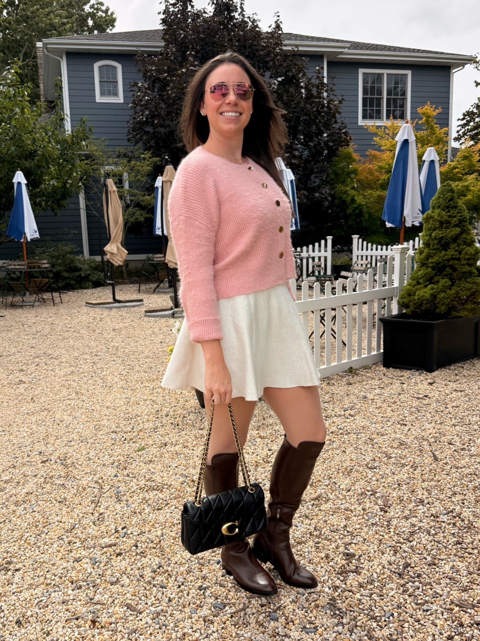 When I get to wear all my fall clothes i am a happy girl! Love a skirt and boot combo and this look is super cozy and effortless thanks to my @coach purse, amazon riding boots, target tights and skirt, pink cardigan and pink aviators!

#LTKgrwm #LTKootd #LTKSeasonal