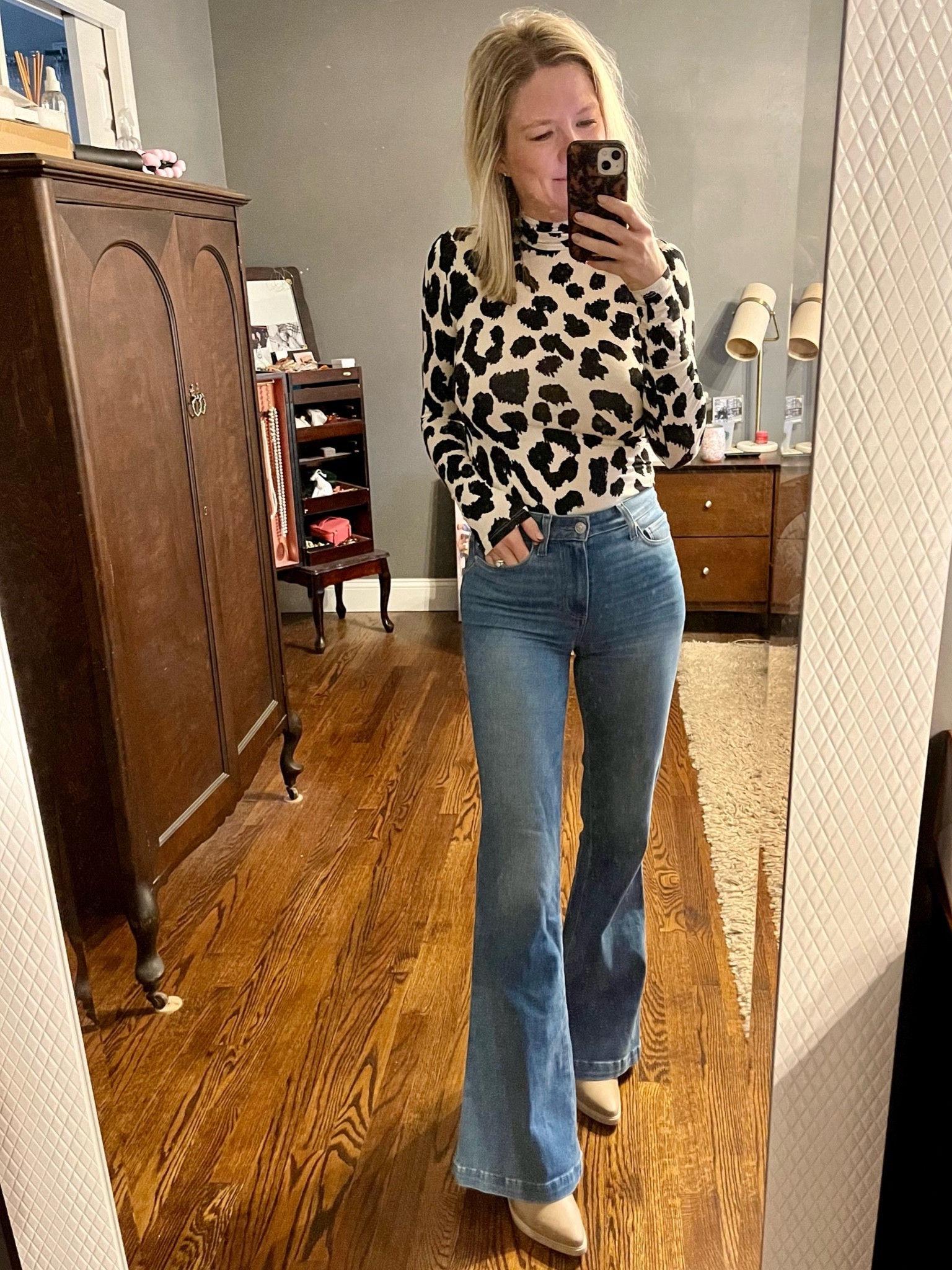 Fitted leopard print turtleneck, perfect alone or layered! Jeans are Paige. 

#LTKfindsunder50 #LTKstyletip #LTKover40