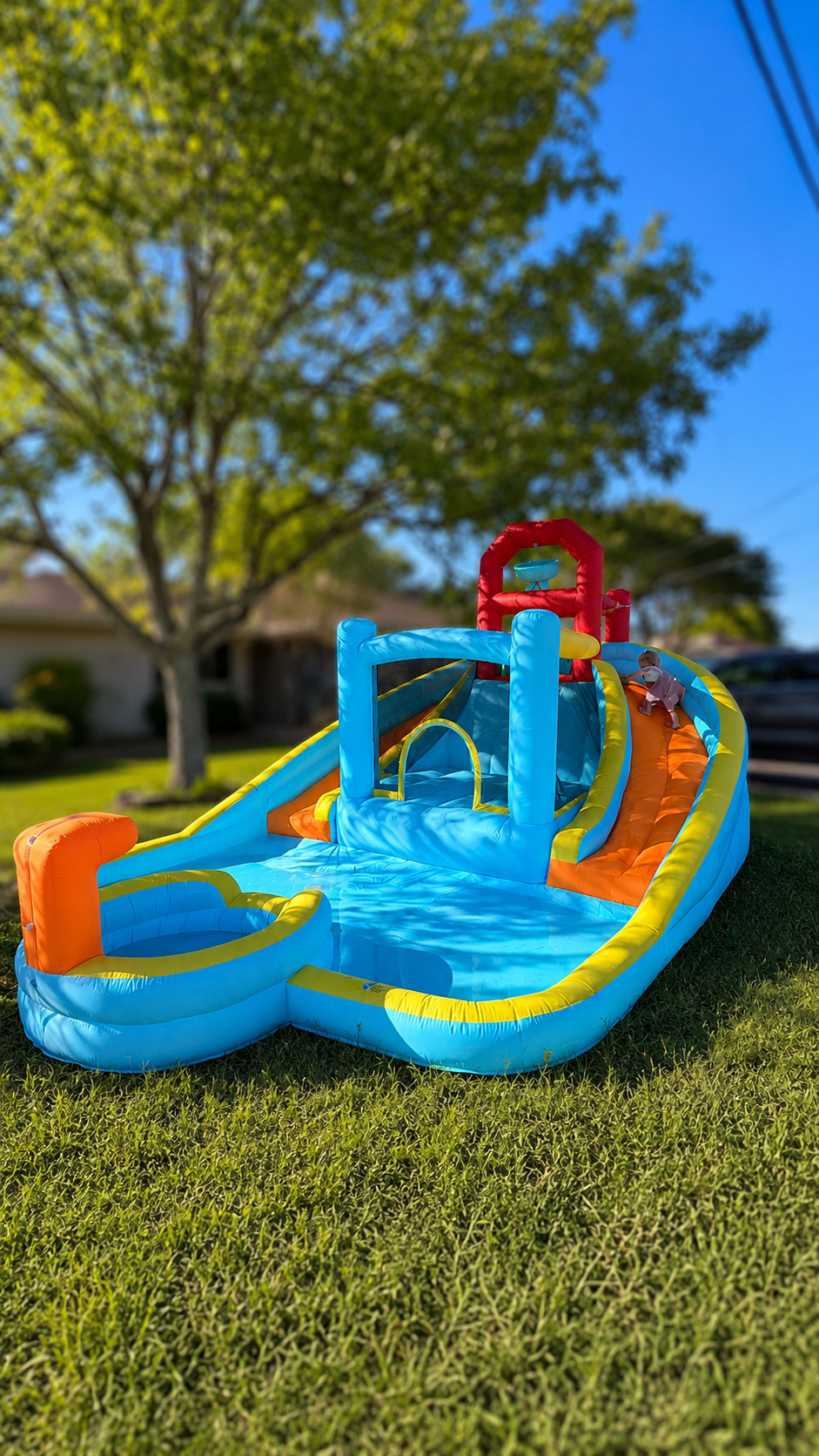I bought this on a flash deal for almost 50% off. IT IS AMAZING! 

The kids have been on it non-stop with the neighbors. The little pool at the end is perfect for my toddler while the bigger kids have two slides to race down on. A bounce house in the middle and a mini climbing wall with a dump bucket. 

Honestly, it's the best water blow up bounce house I have ever used. 

I included one other one I considered that looks really cool. The little kiddie pool was the swaying feature for the one I got due to my kids age gap. But the other one pictured had me really tempted. I can only vouch for the one I have pictured but it is the same brand.  

 #LTKSeasonal #LTKSaleAlert #LTKKids