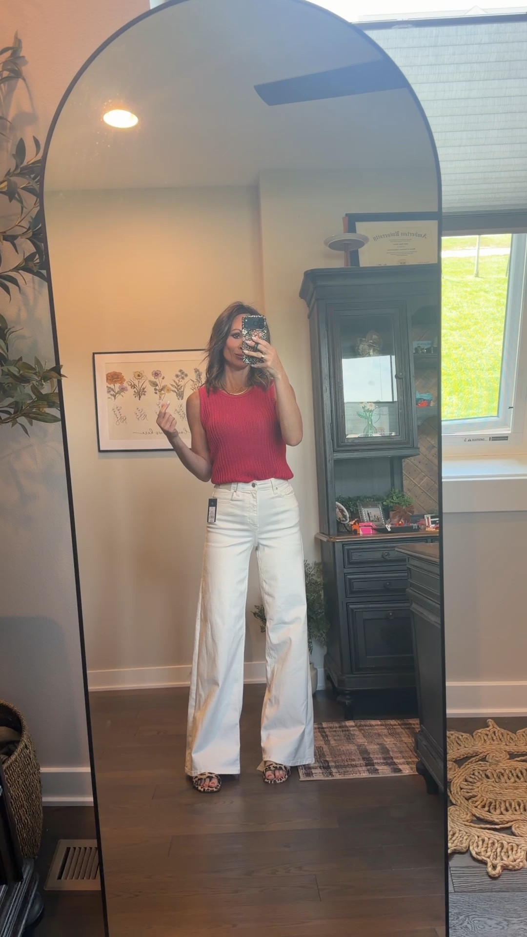 These white wide leg jeans are the perfect denim for spring and summer. They look and fit like designer, the only thing is I would size up two, but one size at least if you like them super snug or need them to be a little shorter as well. The sweater tank is so great and the shoes are a fun leopard pop with a thick lower heel. But, the star of the show is definitely the denim! And, they are on sale and under $25!

#LTKSeasonal #LTKOver40 #LTKmomlife