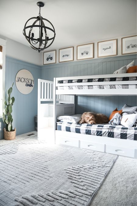 Big boy bedroom! Bunk bed with drawer storage high low area rug boutique rugs custom vehicle prints, wall art from Etsy Gallery, photo and picture frames target vines, nursery name, sign, faux, artificial, cactus, round, or chandelier, light fixture trucks race cars monster truck airplane motorcycle 

#LTKFind #LTKhome #LTKkids