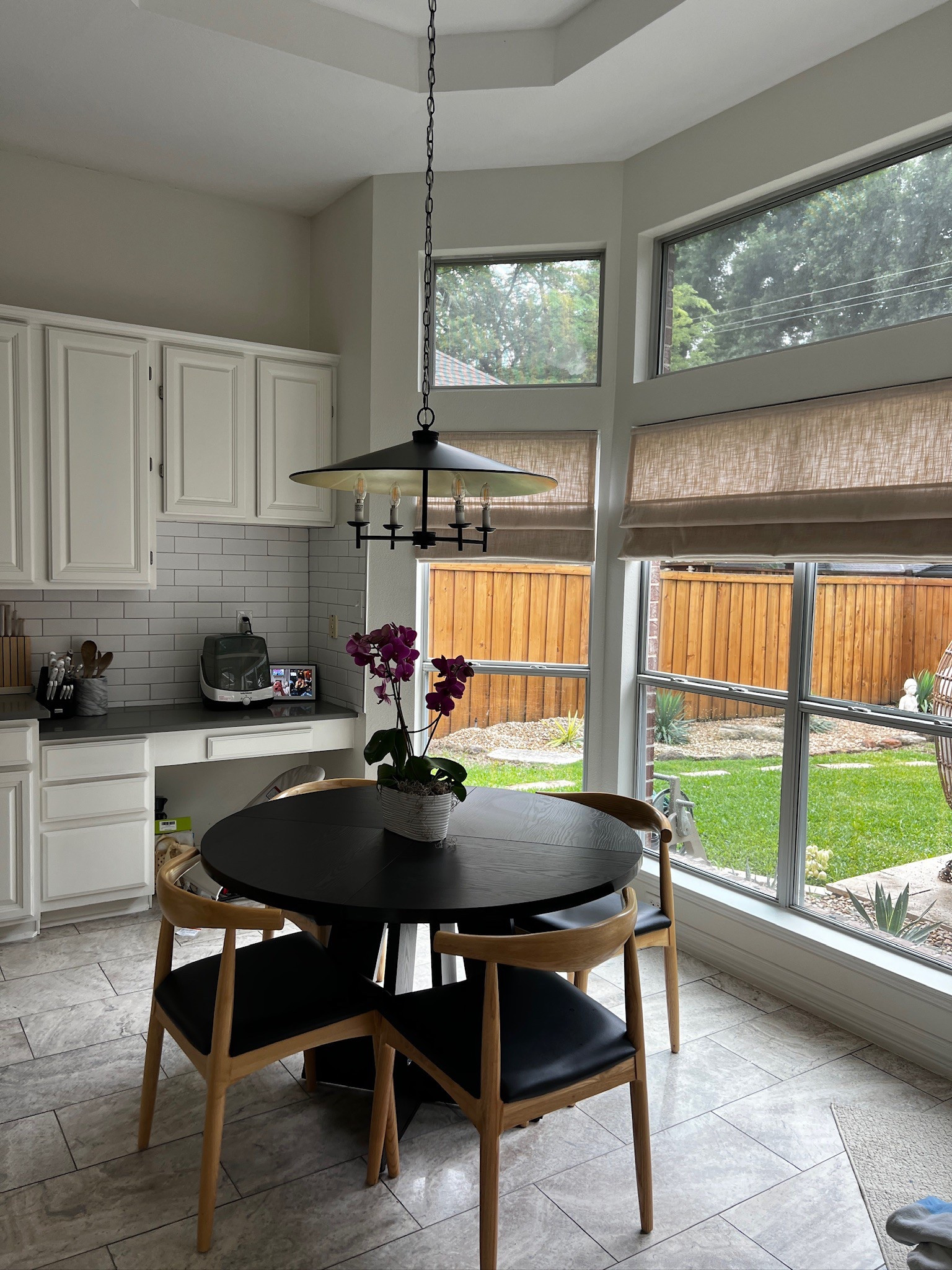 We swapped in a kid-friendly dining table and obsessed is an understatement when it comes to this pendant chandelier—stunning and under $300! Also updated the blinds with these motorized Roman shades in sand beige (inside mount, 60% light filtering) and loving the cozy upgrade.