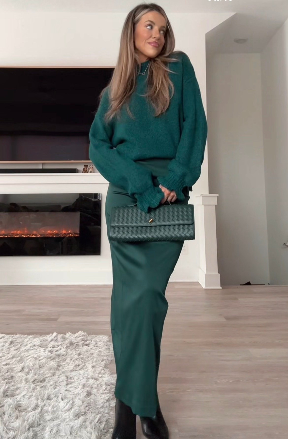Emerald green sweater 

Emerald green skirt

Emerald green woven bag 

Black boots

#LTKootd #LTKHoliday #LTKSeasonal