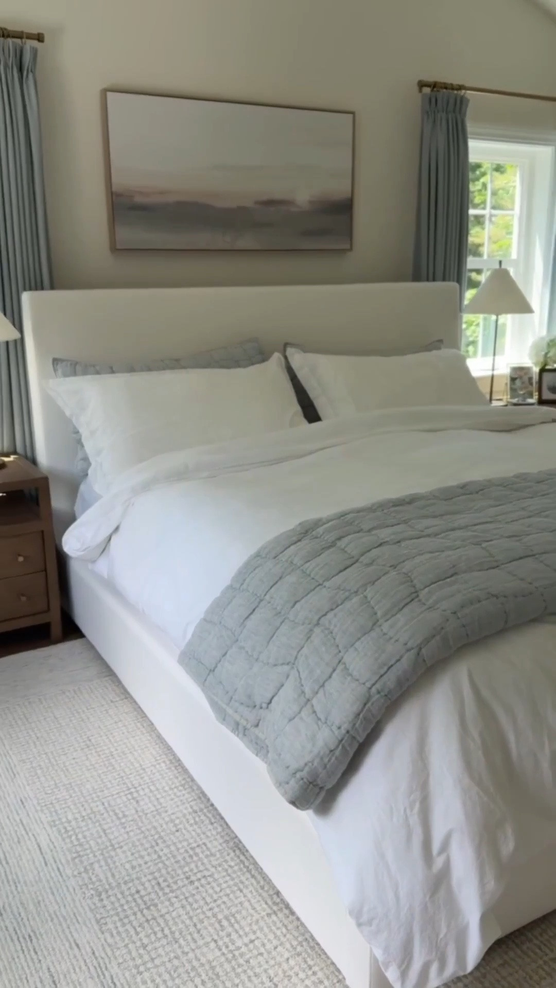 Modern coastal primary bedroom with touches of blue that is functional and beautiful! Shop it here! Pottery Barn quilt on sale!

#LTKHome #LTKSaleAlert