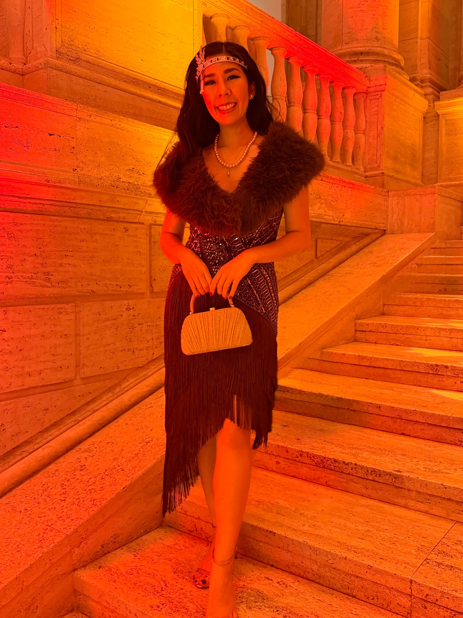 I’ll take any excuse to dress up so themed parties are always an exciting opportunity for me to tap into the creative part of my brain. My company had a 1920’s themed New Year’s party and it was wonderful to see everyone all dressed up! I wanted a unique dress and this asymmetrical fringe one definitely checked that box. This mahogany dress has beautiful beading on top and since it was a bit chilly, I layered up with a faux fur shawl. 

I have no idea how the ladies of the 20’s did it but my head was throbbing by the end of the night. The headpiece left an enormous indent after wearing it for 5 hours; I was so glad to pop it off my forehead and let my skin come back to its normal form!

Since there was already so much going on, I kept the rest of my accessories simple. I went with a single strand of pink freshwater pearls on top of a single pearl drop necklace. I wanted to keep with the times so I got this beautiful gold metallic art deco top handle evening bag. It was really moody inside with the lighting so pictures don’t do this look justice but it was such an incredible night with even better company.

#1920s #flapper #fringedress #fauxfur #artdeco #partyoutfit #greatgatsby #pearls

#LTKootd #LTKdayinmylife #LTKPetite
