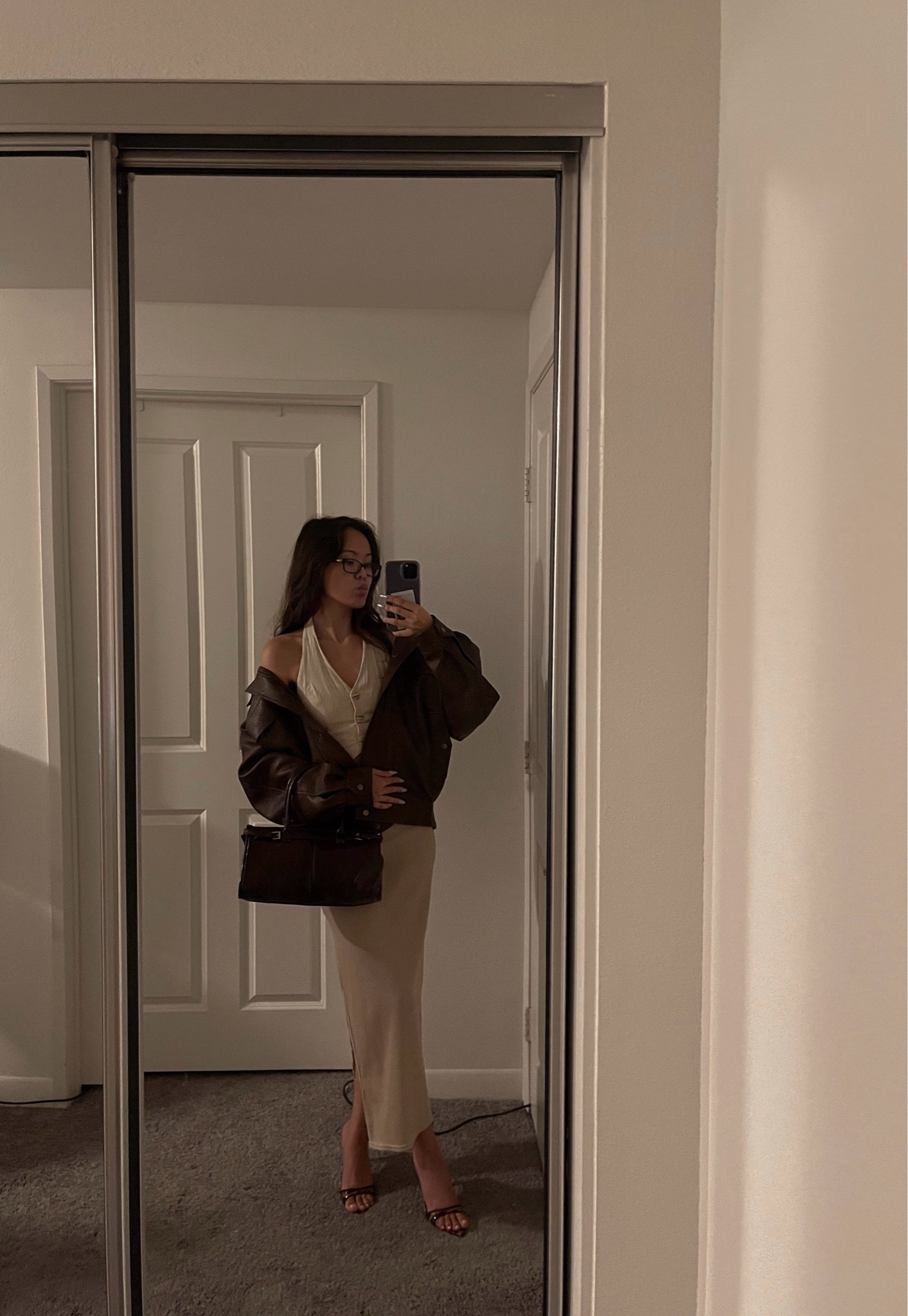 Ngl this look feels like a summer outfit turned early fall outfit 👀 

I love wearing different shades of brown together and this is no different. Linking similar halter tops and chic midi skirts below.

date night outfits, travel outfits, neutral outfits

#LTKootd #LTKdayinmylife #LTKgrwm