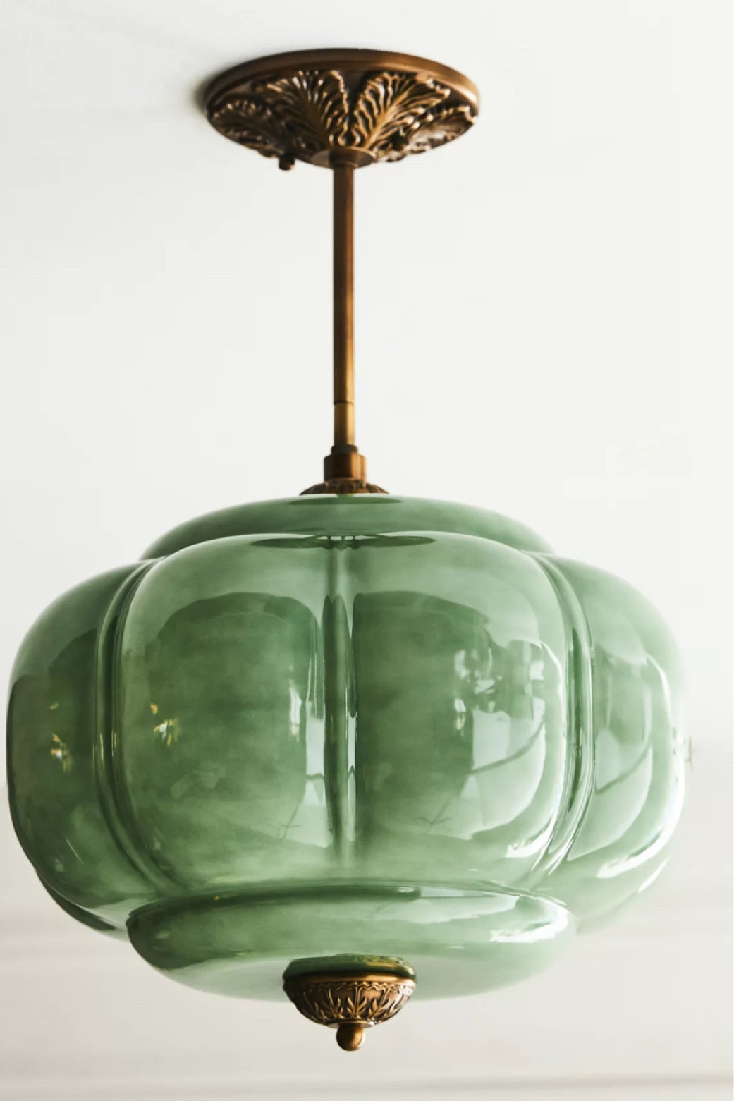 Vintage Inspired Eloise Glass Semi-Flush Mount with a milk glass shade and an oil brass frame 