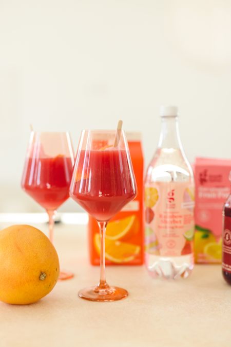 Make a Summer Sparkler to keep cool this season in a few easy steps 🍦

This is a fun, non-alcoholic refresher that the whole family (and kids) will love. Mix equal parts @target Good & Gather chilled cranberry juice and orange juice (or any other juices you love) along with 2 parts sparkling water of choice. Peel grapefruit zest, twist and drop in and add an optional popsicle to your glass to keep things cool!
