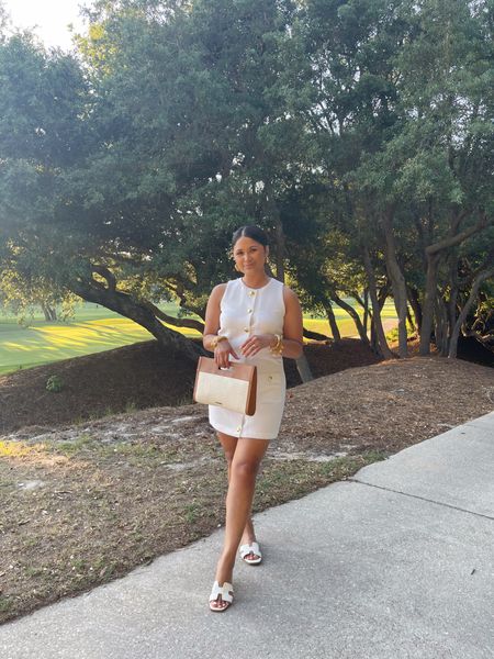 How cute is this gold button down mini dress by Jenn lake & sail to sable? I hemmed mine bc I’m only 5 ft. Would probably look better with heels, but I wore with sandals since I had blisters from my heels the night before.—wearing sz small
#whitedress #raffiabag #giginewyork #stevemadden #sandals 

#LTKItBag #LTKStyleTip #LTKTravel