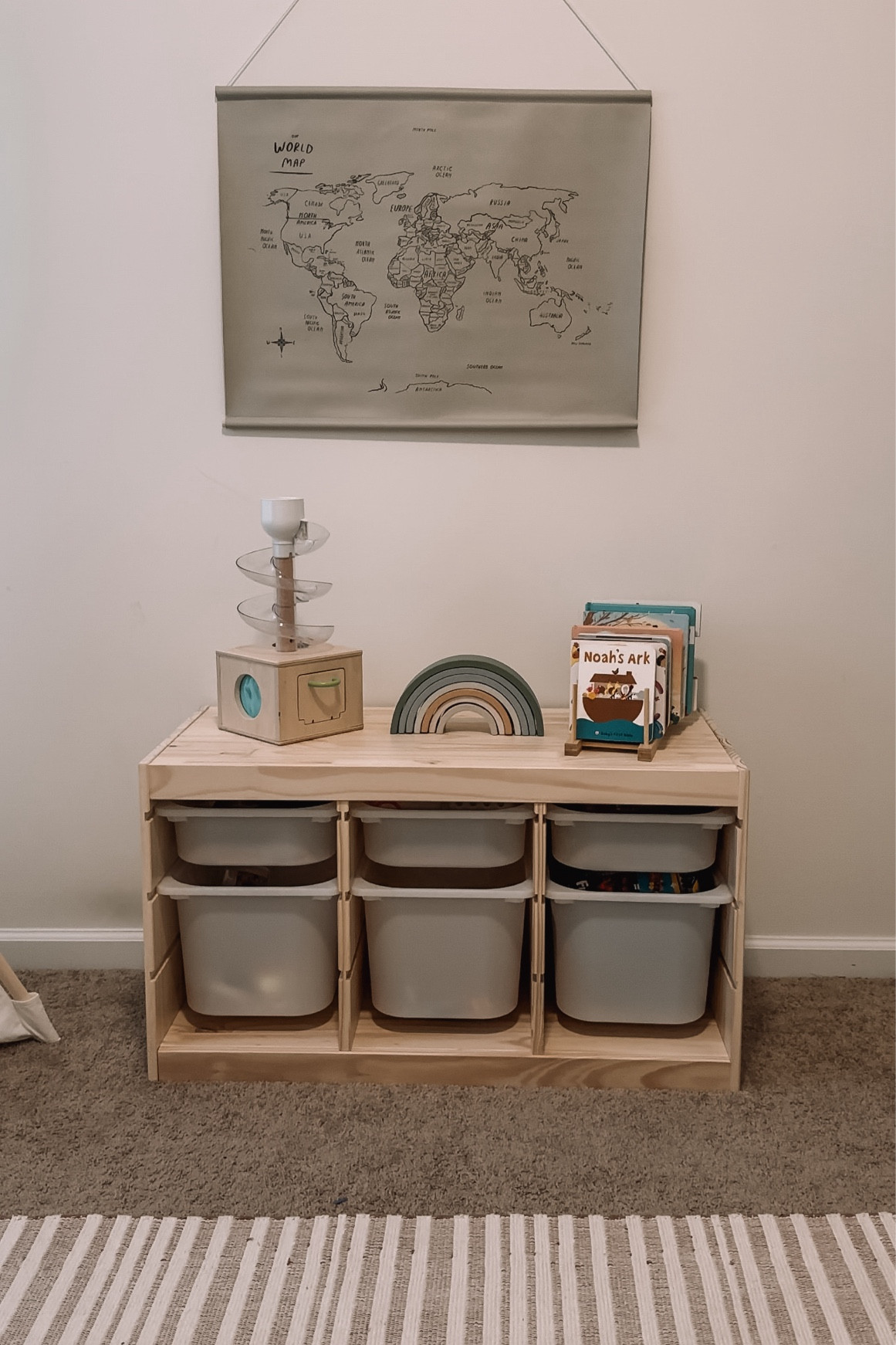 Loving this part of our playroom! The gathre world map looks great with the ikea trofast. We love all the neutral wooden toys like our lovevery kits and we use a pot holder for our books! Love all the natural touches! 

#LTKbaby #LTKkids #LTKfamily
