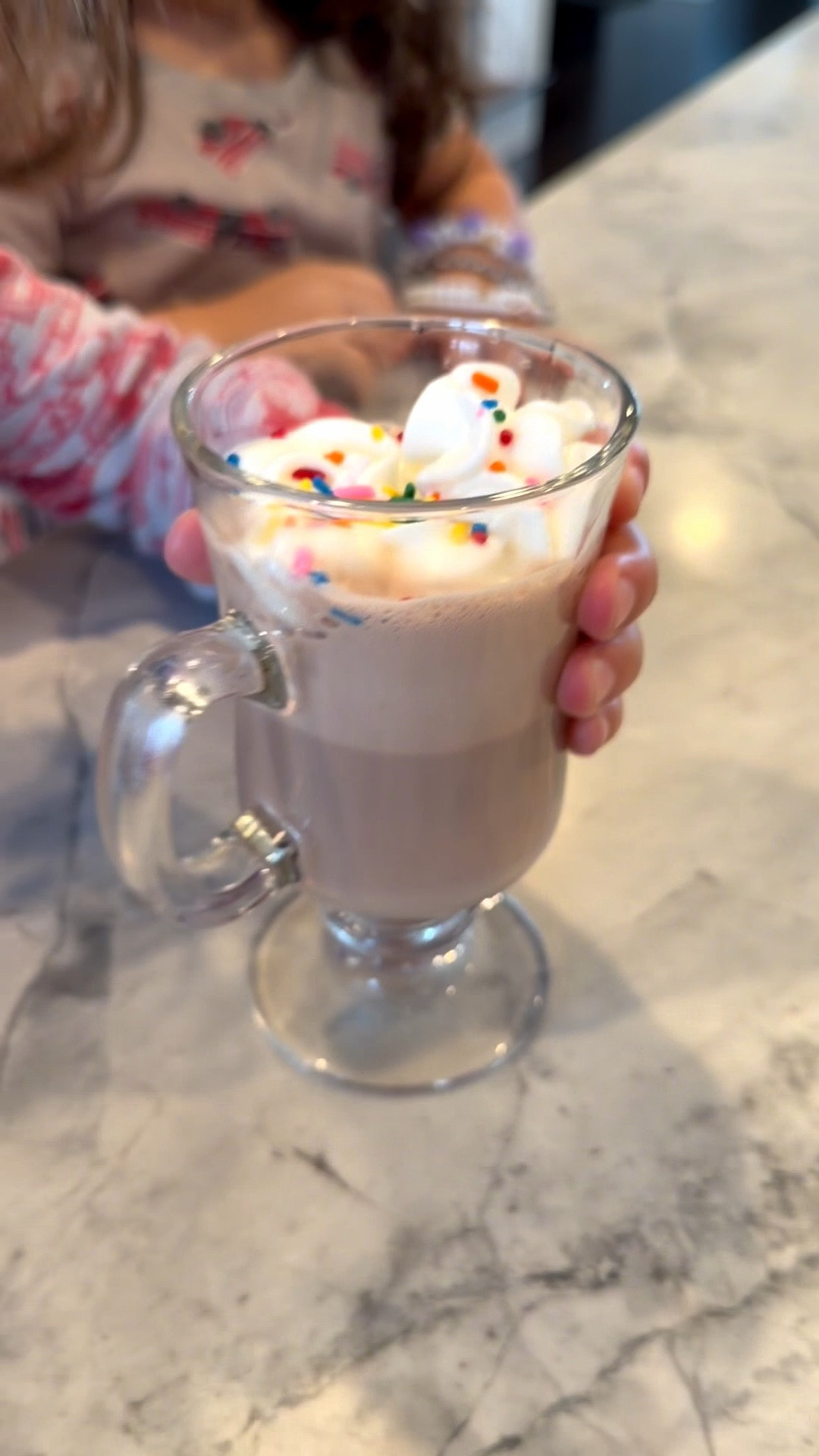 Hot chocolate time for the kids! I’m using Breville Barista Touch with its hot chocolate function to make a cup of cozy for my kids. I used high-protein lactose-free chocolate milk, topped with whipped cream and rainbow sprinkles, and served it in the cutest Irish mug. Tap the post to shop the exact mug, the lactose-free chocolate milk, whipped cream, and sprinkles, plus a cozy add-ons kit for future nights in. #LTKFood #ShopThePost #LTKKids #FamilyTreats #HotChocolate #Breville #MugLove